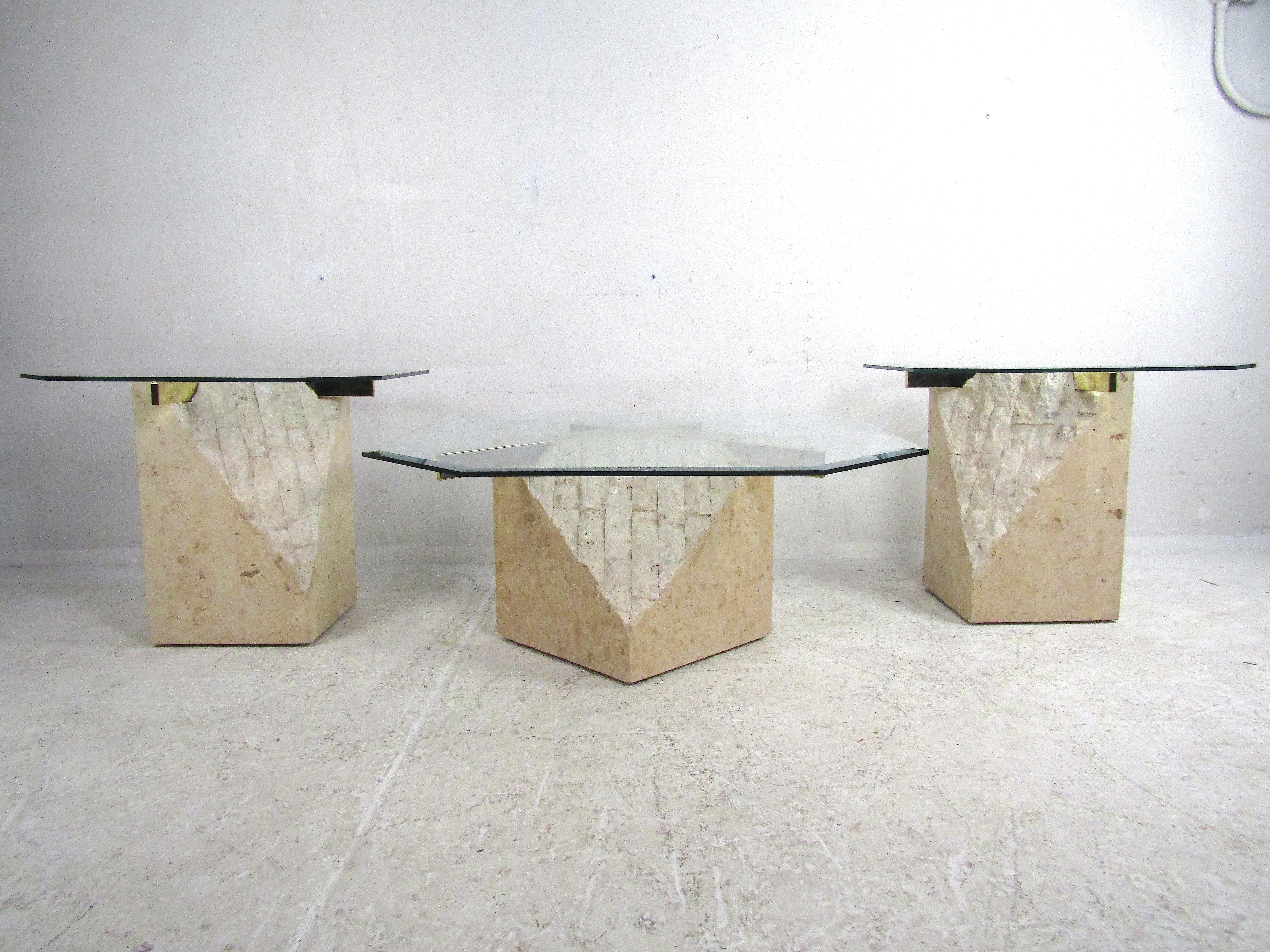 Stunning set of 3 midcentury Artedi style coffee and side tables. Faux-stone bases with brass cross-sections support 1/4 inch glass tabletops with beveled edges. Great set of tables sure to liven up any modern interior. Please confirm item location