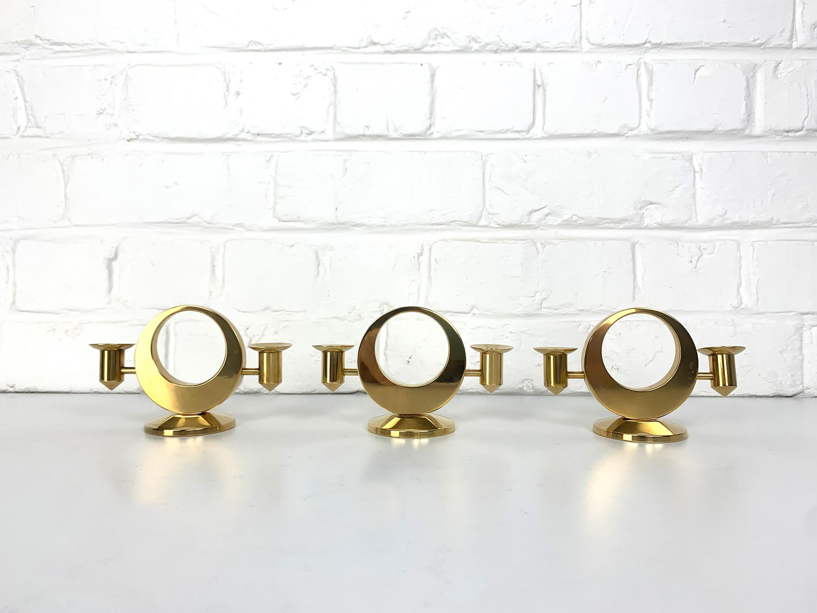 A set of three Mid-Century Candelabras for 2 candles each in solid brass. 

Created and made by Arthur Petterson, he signed his candleholders “Arthur Pe Kolbäck”.

He was born in 1919 in Kolbäck, Sweden, where he lived and worked all his live.