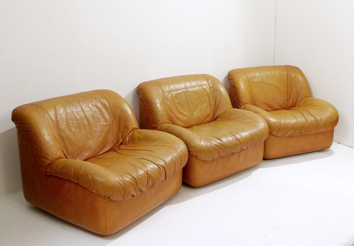 Set of 3 mid century Italian Moroso armchairs in cognac leather.