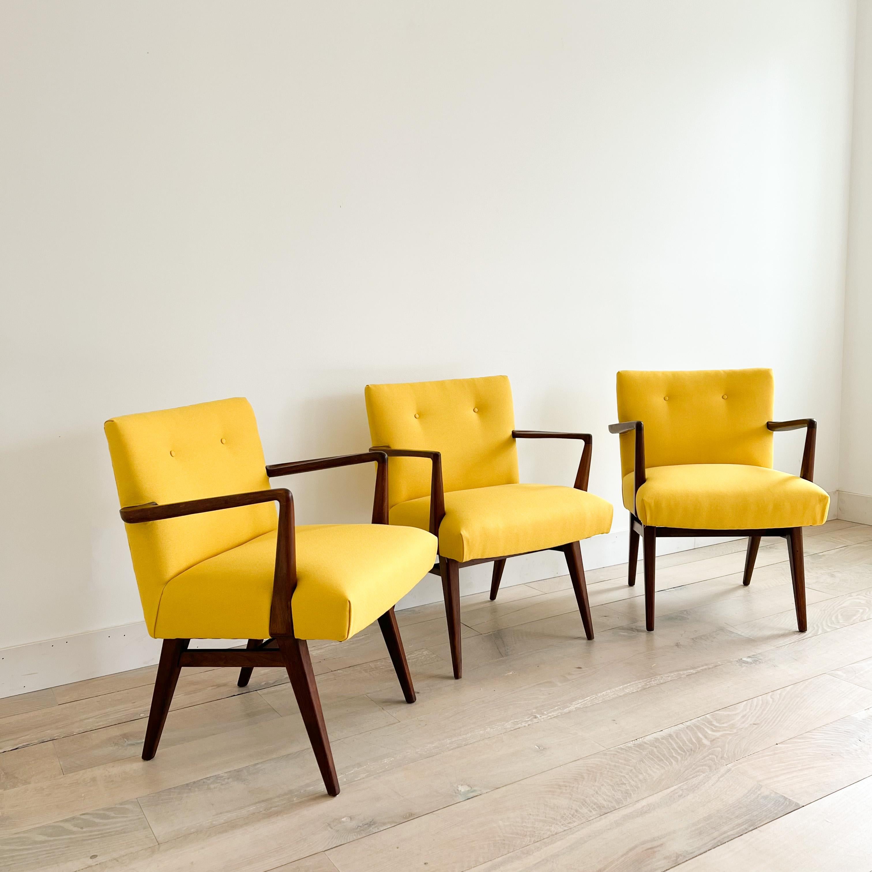 We have 3 of these Mid-Century Modern Jens Risom armchairs in stock. New yellow upholstery. Some scuffing/scratching/fading to the walnut bases from age appropriate wear.
 