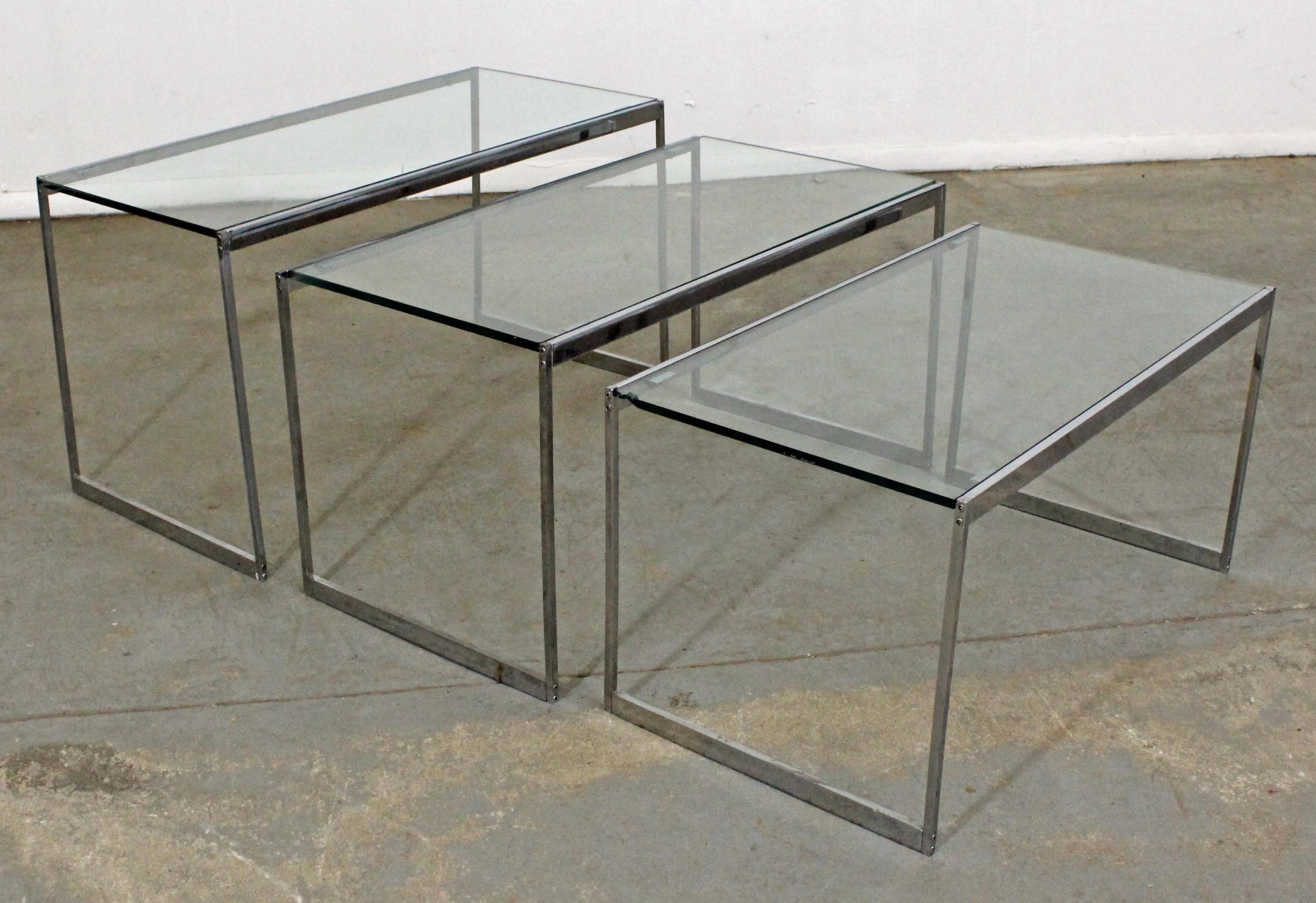 Set of 3 Mid-Century Modern chrome glass top nesting end tables

Offered is a set of 3 Mid-Century Modern glass top and chrome nesting tables. They are in decent condition showing some age wear (see pictures). They are not signed. Check out our