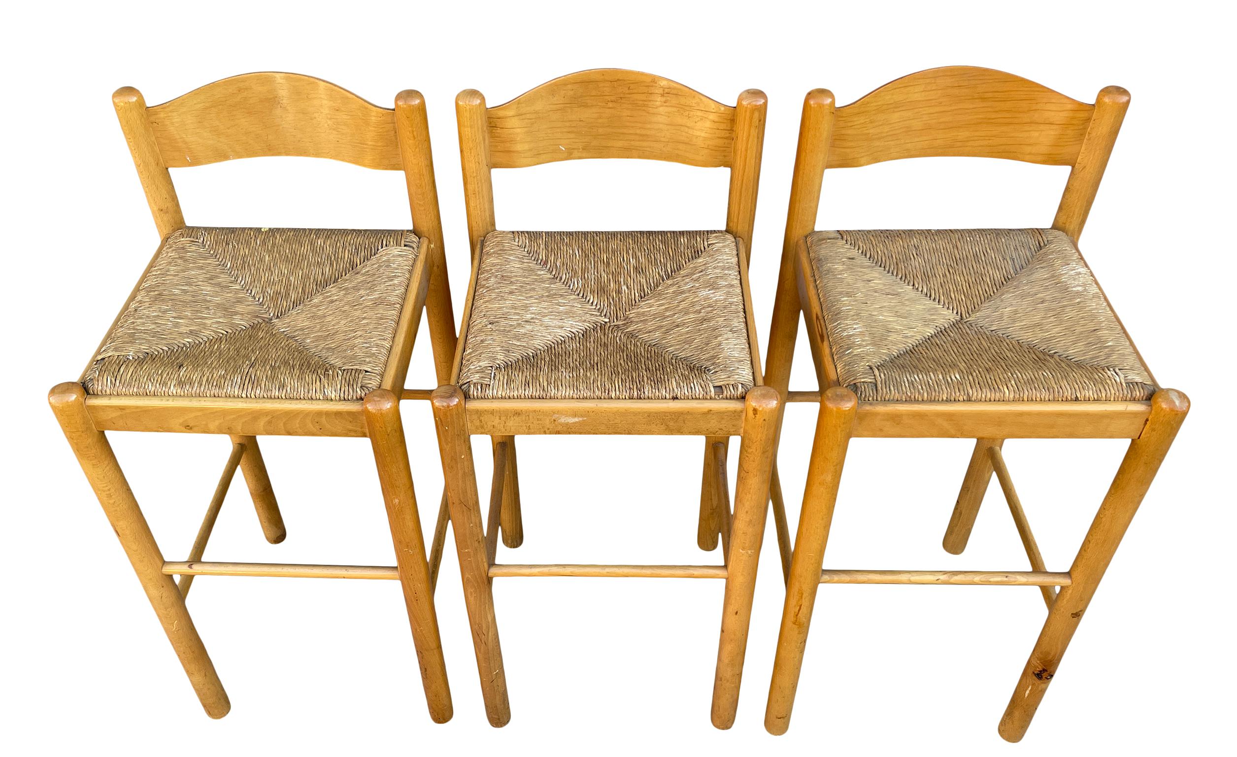 Set of 3 Mid-Century Modern bar stools circular maple framed and rush woven seats with bent plywood back rests. 30” seat height. Solid sturdy stools in good vintage condition. This listing is for the set of 3 stools.