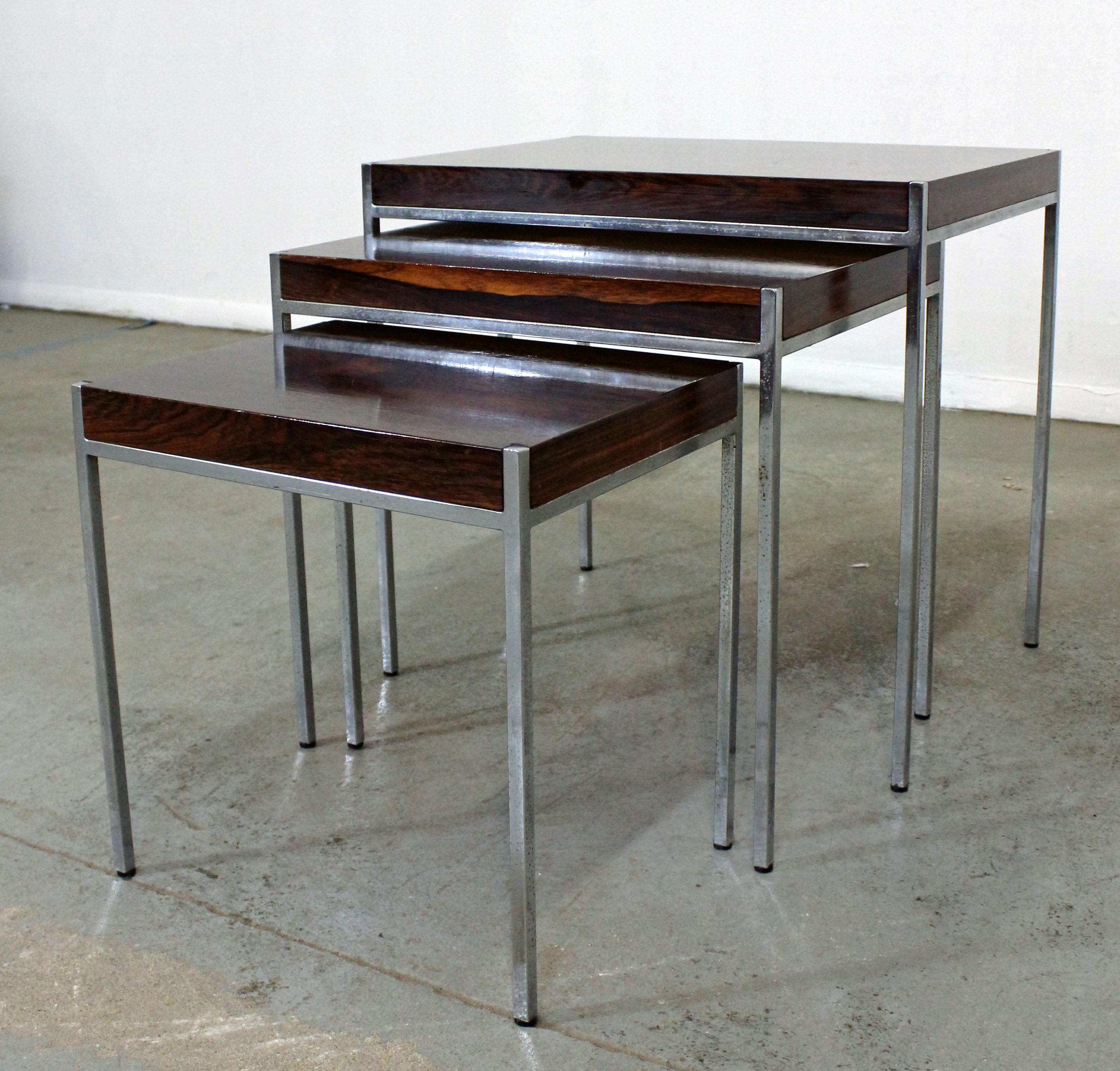 What a find. Offered is a set of 3 rosewood & chrome nesting tables. They are in good condition showing some age wear (patina on legs, surface scratches). We believe they may be by Milo Baughman, but they are not signed. Check out our other listing