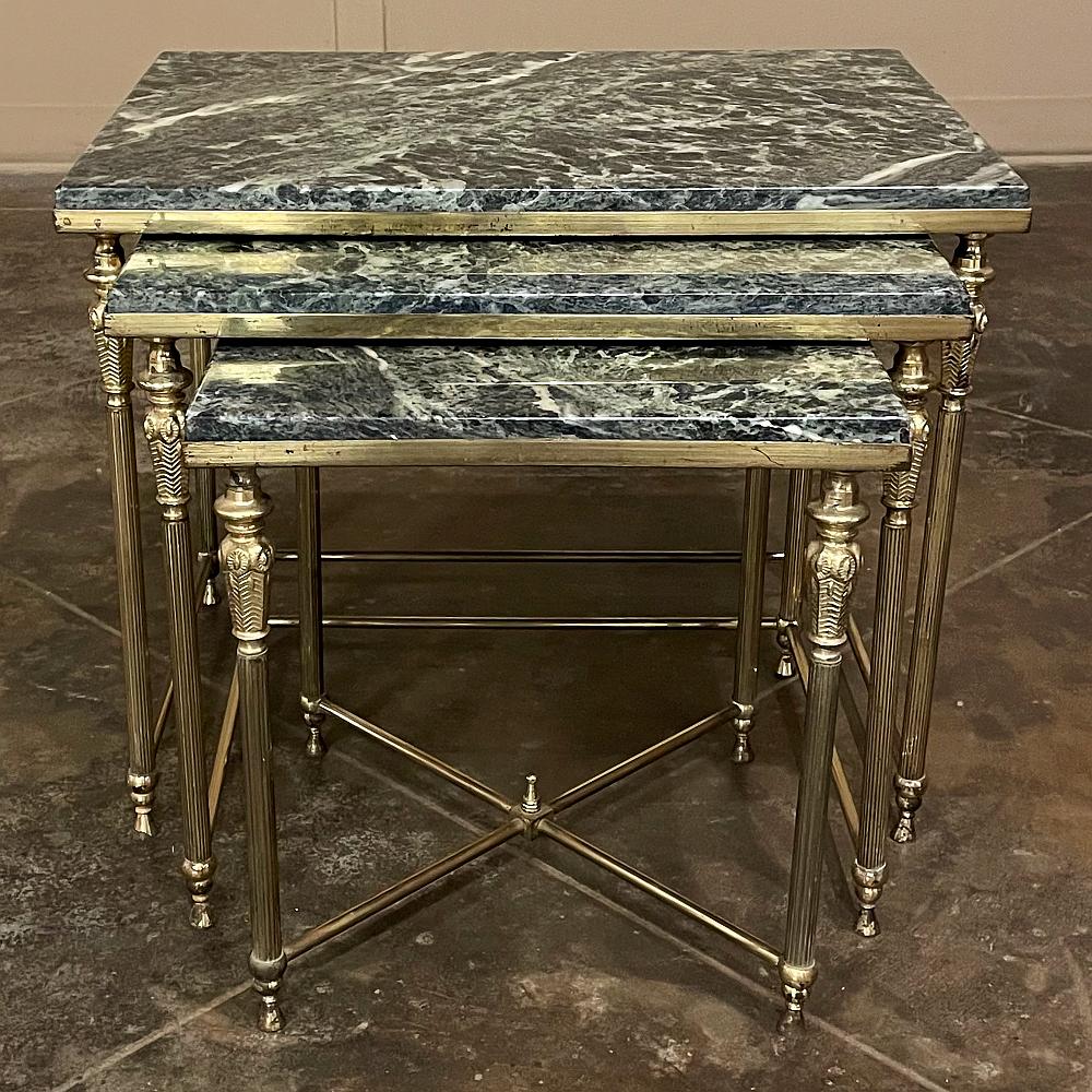 Set of 3 mid-century neoclassical brass & marble nesting tables are the perfect answer to your entertaining needs! Crafted from brass in a classical design that has its roots in ancient Greece and Rome, it features a stately elegance that literally