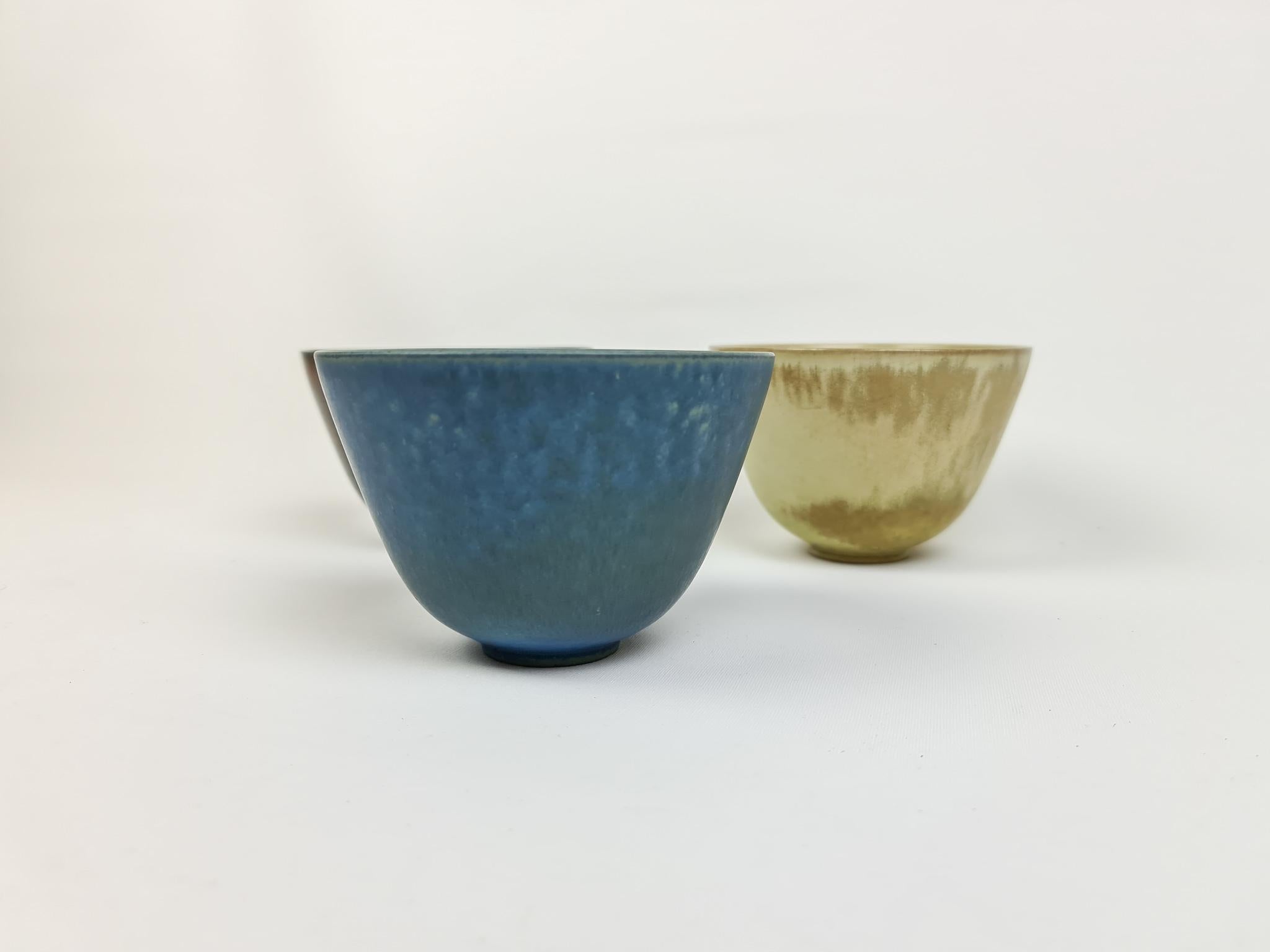 Three wonderful bowls from Rörstrand and maker or designer Gunnar Nylund. Made in Sweden in the midcentury. Beautiful glazed bowls in good condition. The structrure and form of the bowls works perfectly with the glaze. 

Measures: Diameter 12.5