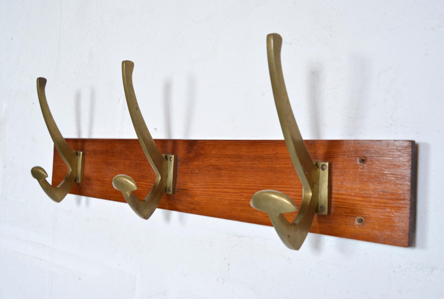 A highly unusual set of three brass coat hangers dating from the 1950s, reclaimed from a Gentleman’s Clubhouse. The lower hook is a broad arm so is perfect for more delicate shaped jackets thus causing minimal stress to your coats or Bowler hat! The