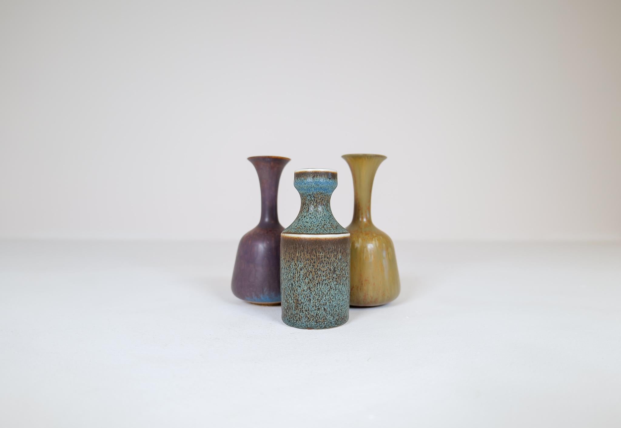 Three wonderful vases from Rörstrand and maker, designer Gunnar Nylund. Made in Sweden in the midcentury. Beautiful, glazed vases with wonderful curves. The craftsmanship on these vases is stunning. The way that the shape and lines of the vases