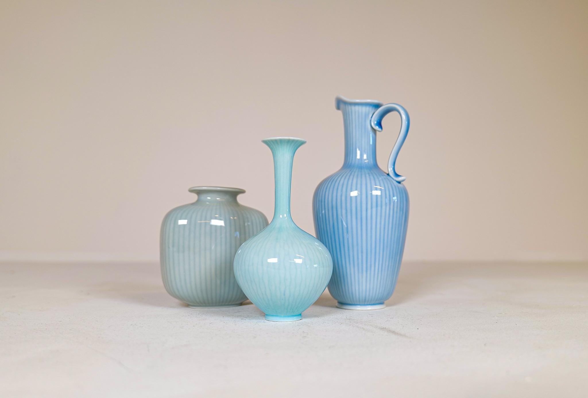 Three wonderful vases from Rörstrand and maker, designer Gunnar Nylund. Made in Sweden in the midcentury. Beautiful, glazed vases with wonderful curves. The craftsmanship on these vases is stunning. The way that the shape and lines of the vases