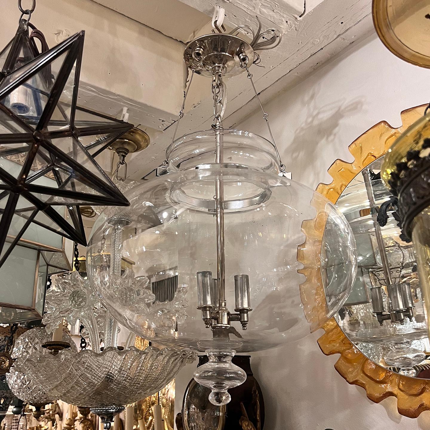 A circa 1970's Italian blown glass lantern with nickel plated body with 3 interior candelabra lights. Sold individually.

Measurements:
Present drop: 34