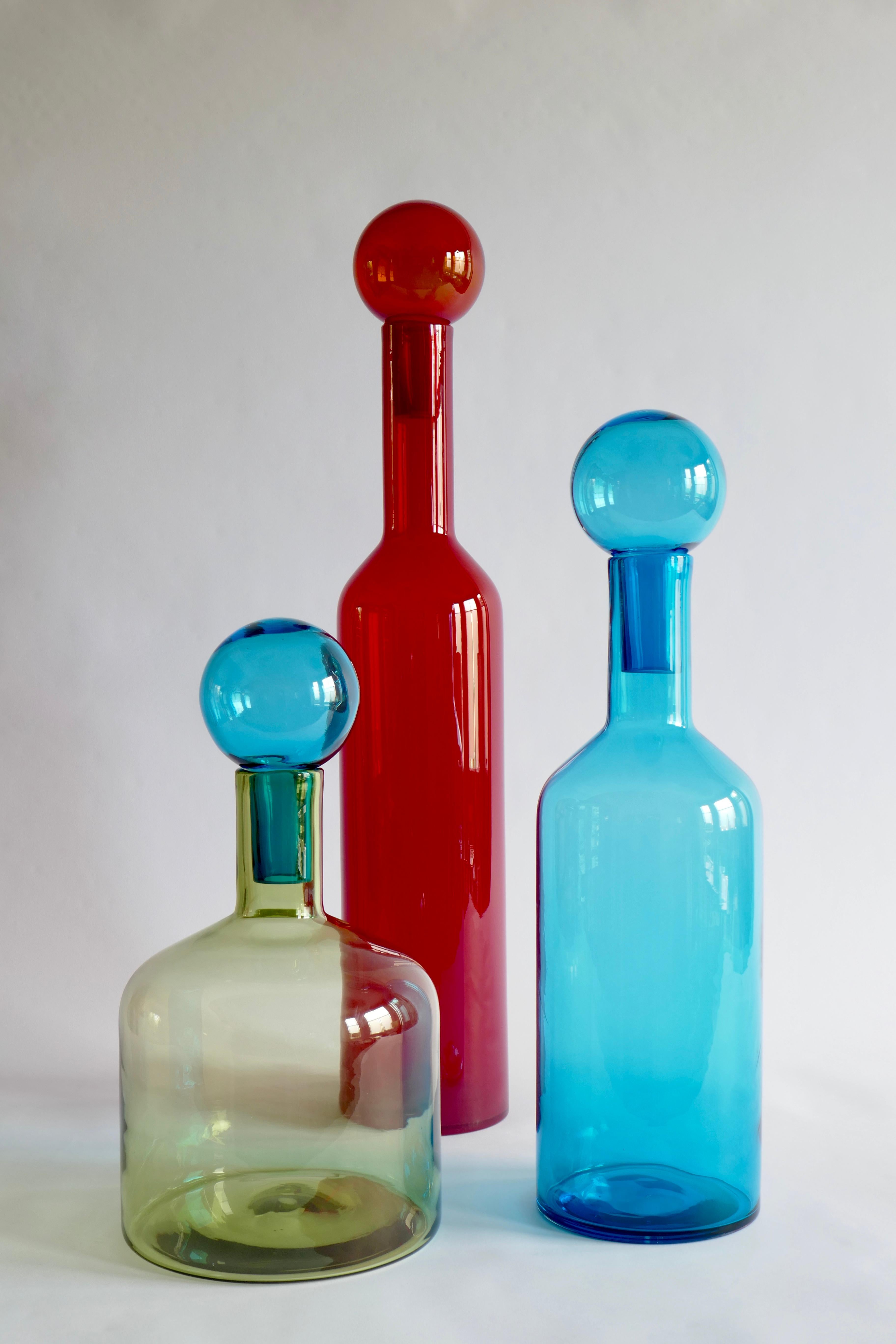 Set of 3 red, blue and green Murano glass bottles, Italy, 2000s
Red one is 75x12cm
Blue one is 56x15cm
green one is 43x23cm.
 