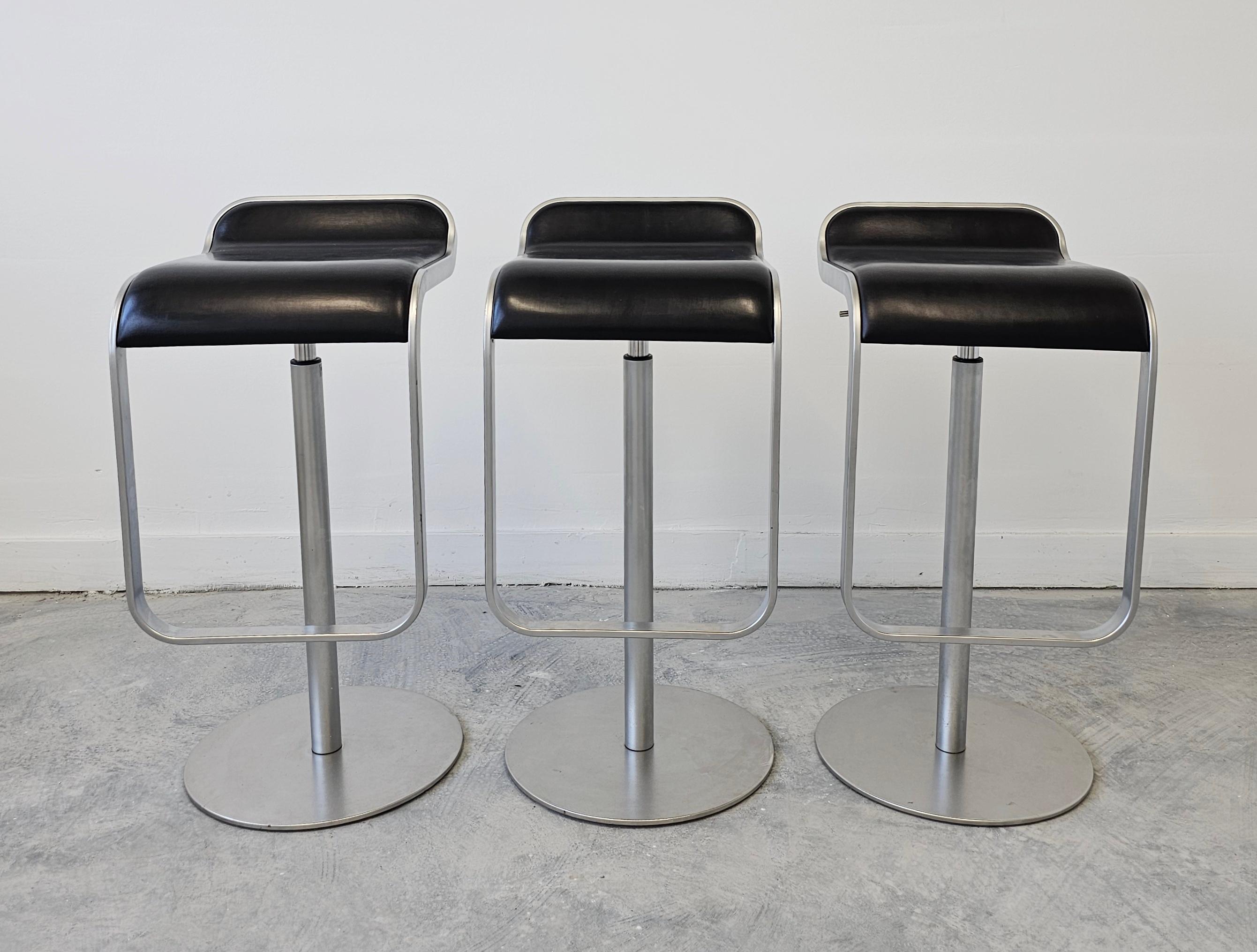 In this listing you will find a set of 3 minimalist barstools, model LEM, manufactured by LaPalma. 

The LEM bar stools were designed by Shin and Tomoko Azumi and named Product of the Year at the FX International Interior Design Awards in 2000.