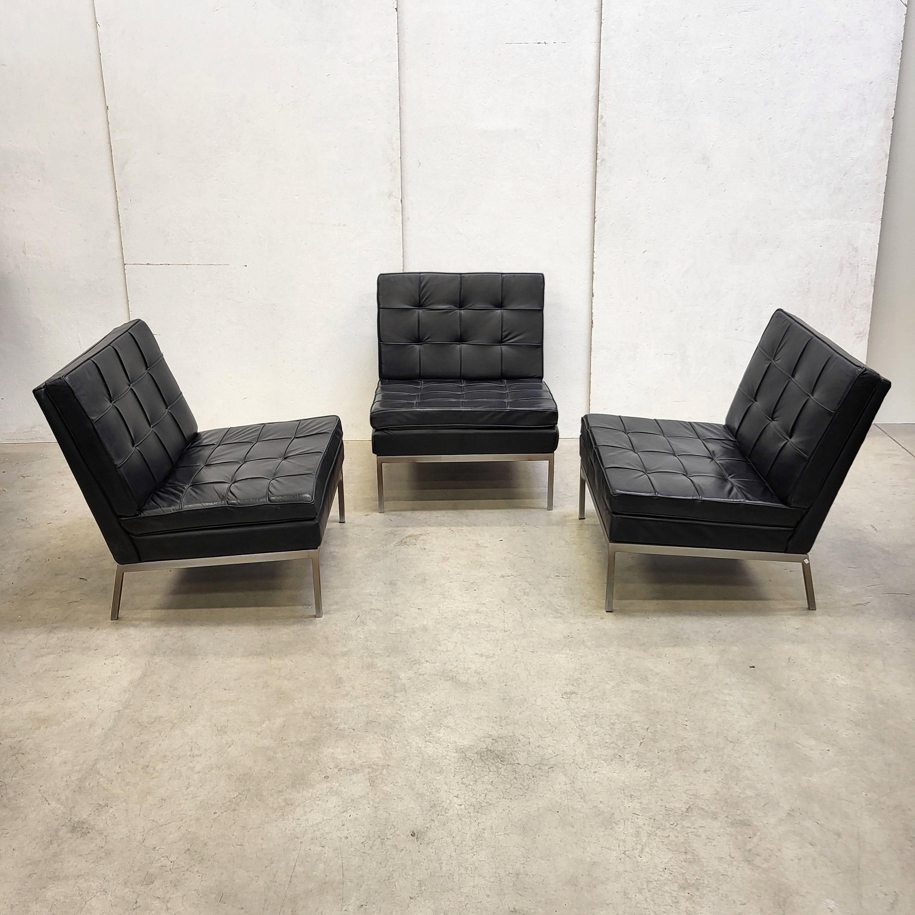 These timeless iconic chairs Model 65 were designed in 1954 by Florence Knoll and produced by Knoll International in the 1960s.

The pieces are upholstered in black leather and are in a very good and clean condition. 

The chairs are full