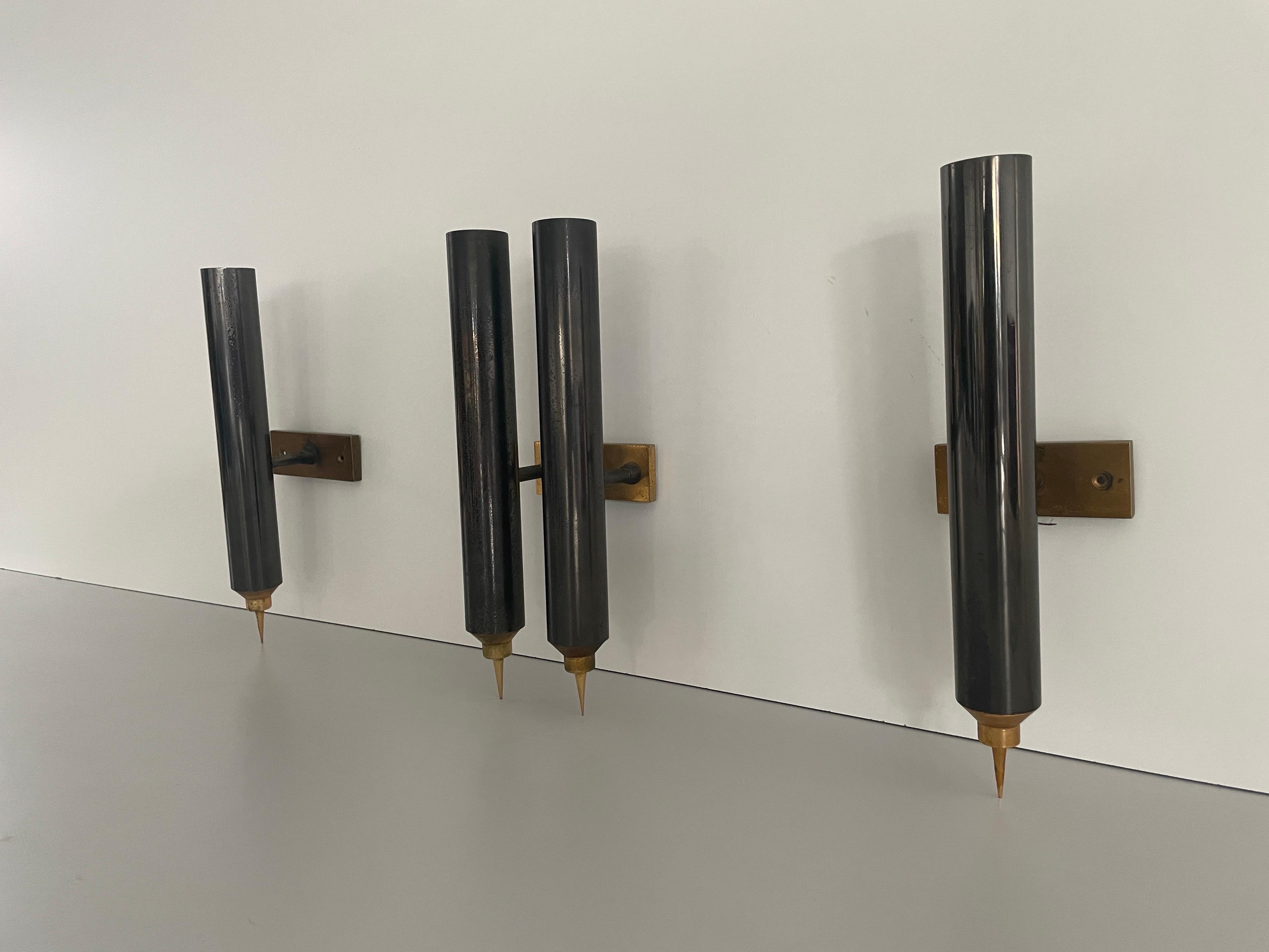 Set of 3 Modernist Tube Design Wall Sconces, 1960s, Italy

Very elegant and Minimalist wall lamps.

Lamps are in excellent condition.

These lamps works with E14 standard light bulbs. 
Wired and suitable to use in all countries. (110-220