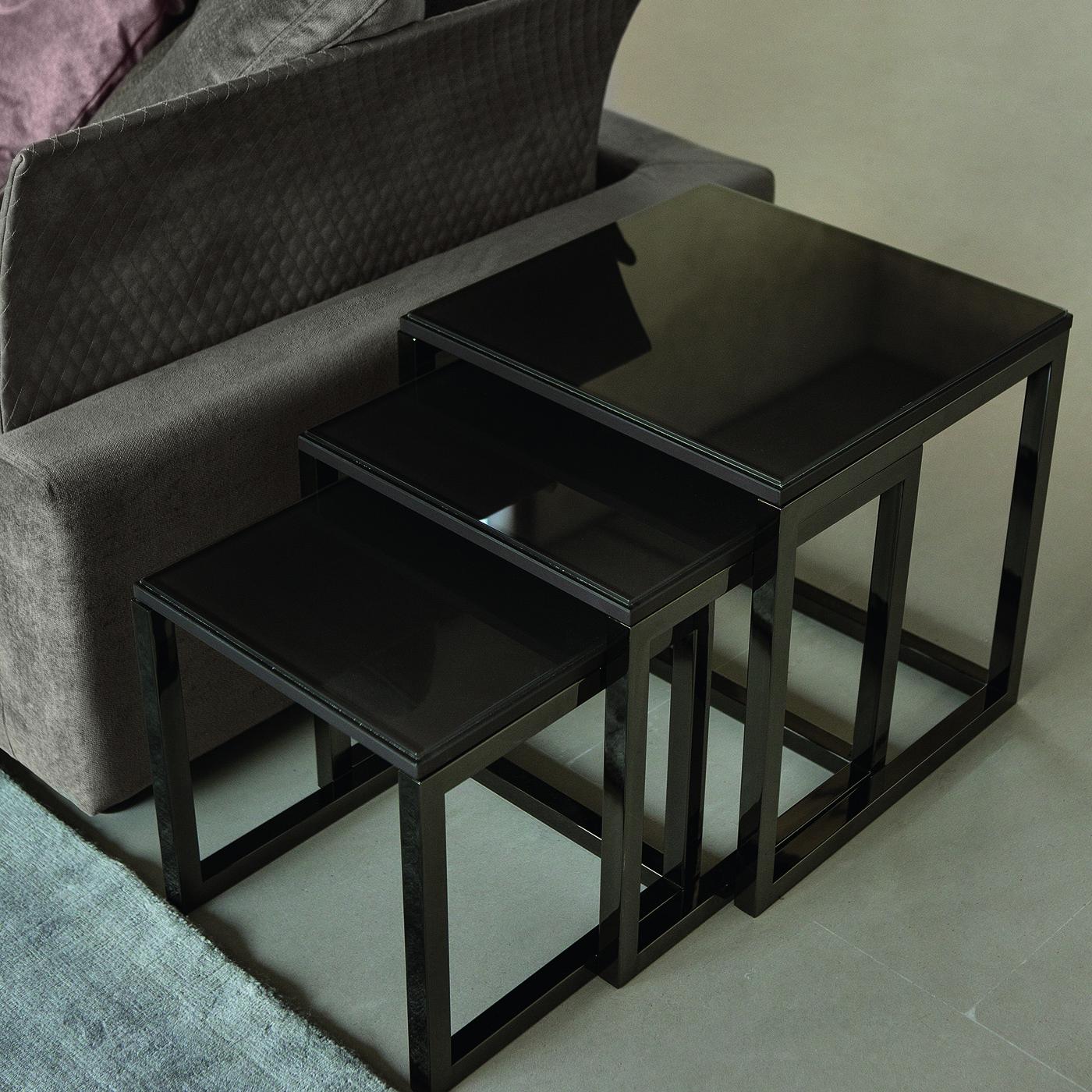 The set of 3 Mondrian tables are classically designed with a sturdy yet sophisticated structure finished in burnished brass or titanium with the top crafted from marble in rich dark tones. An elegant addition to compliment any setting.



