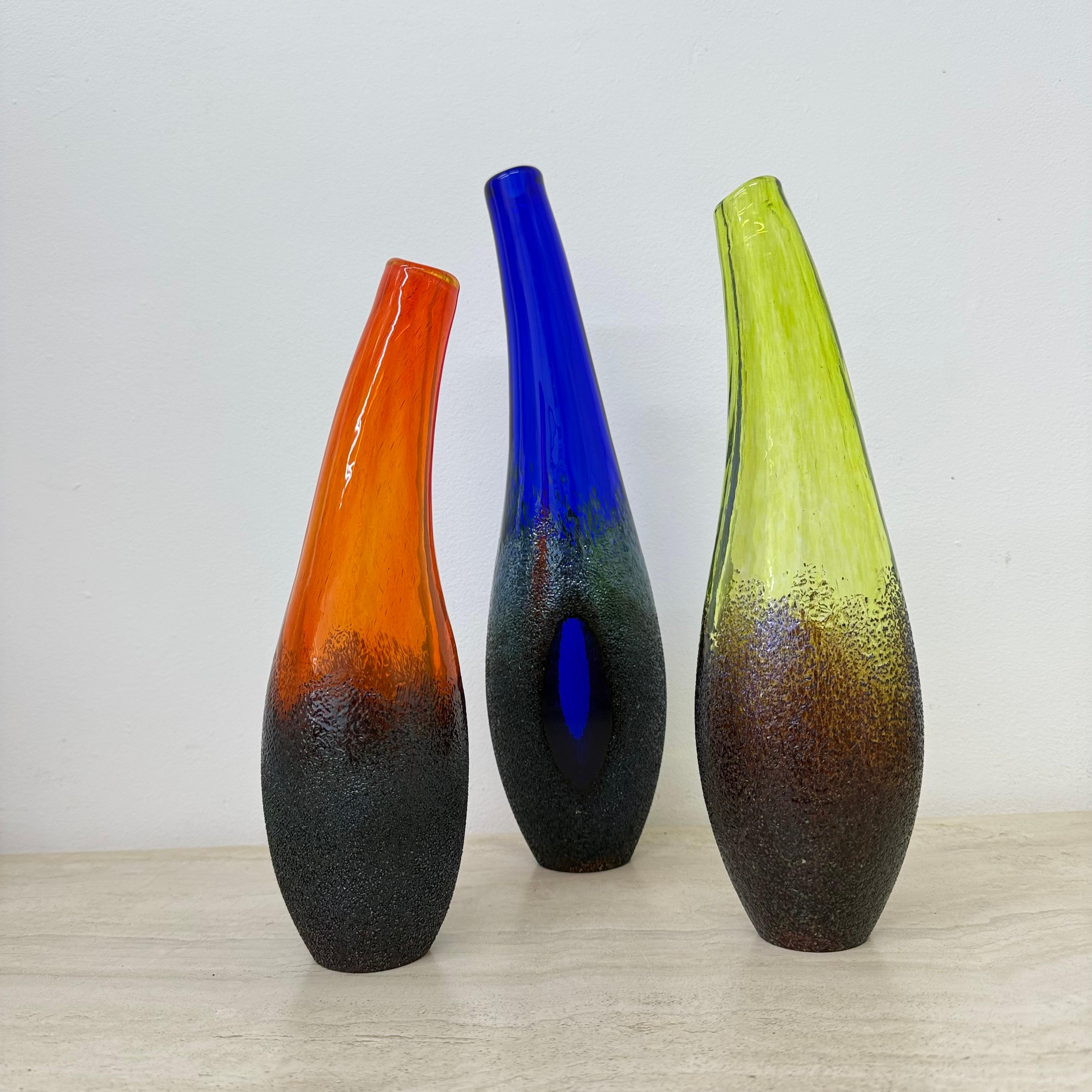 Designer: Monica Backstom
Producer: Kosta Boda
Dimensions: 38cm Height , 10 cm width , 7,5 cm depth  32cm height , 8.5cm width , 8 cm depth  29,5cm Height , 8cm width , 8cm depth
Material: Glass
Material: Glass
Condition: Mint
Origin: Sweden