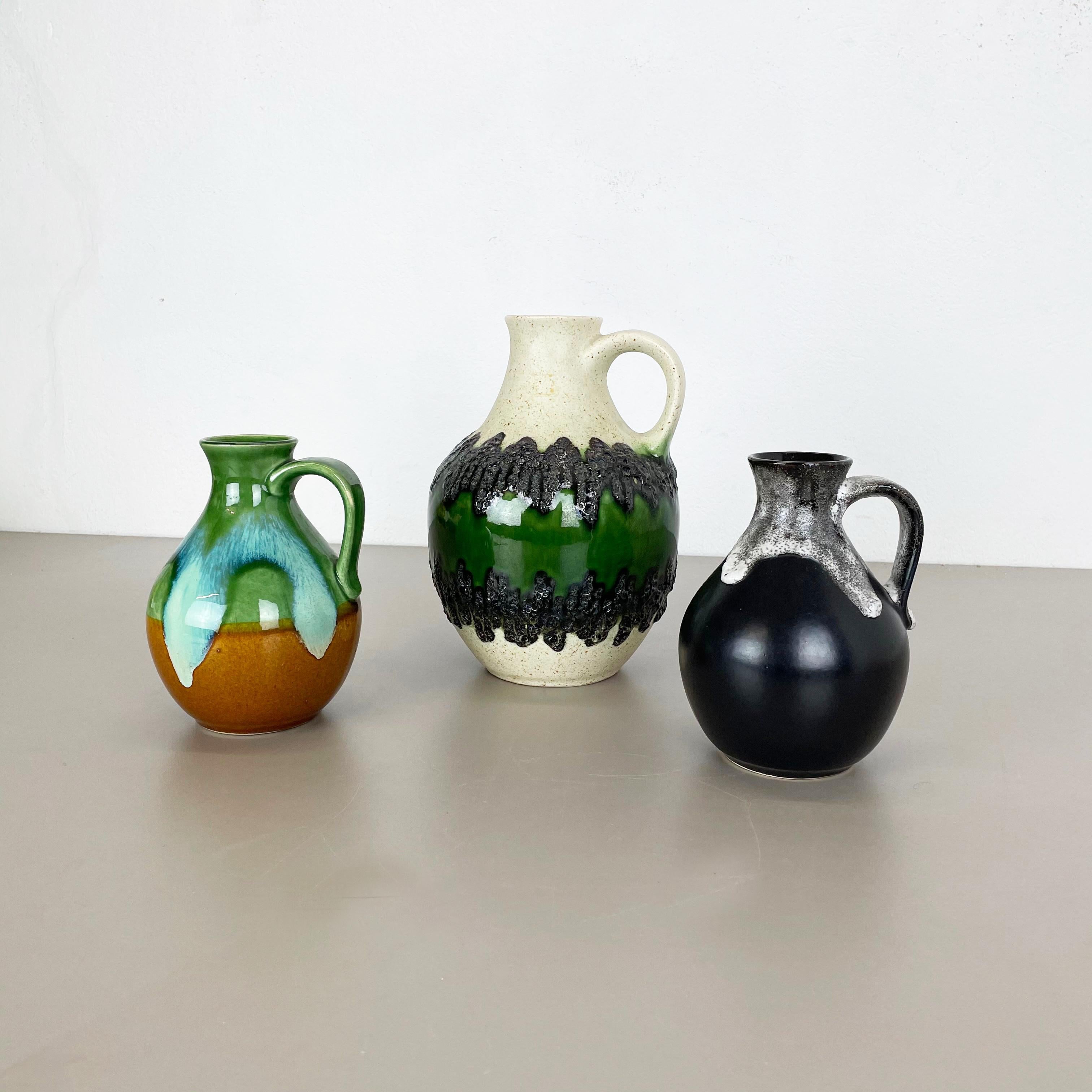 Article:

Pottery ceramic vase set of 2


Producer:

BAY Ceramic, Germany


Decade:

1970s



Description:

Set of 3 original vintage 1960s pottery ceramic vase made in Germany. High quality German production with a nice abstract