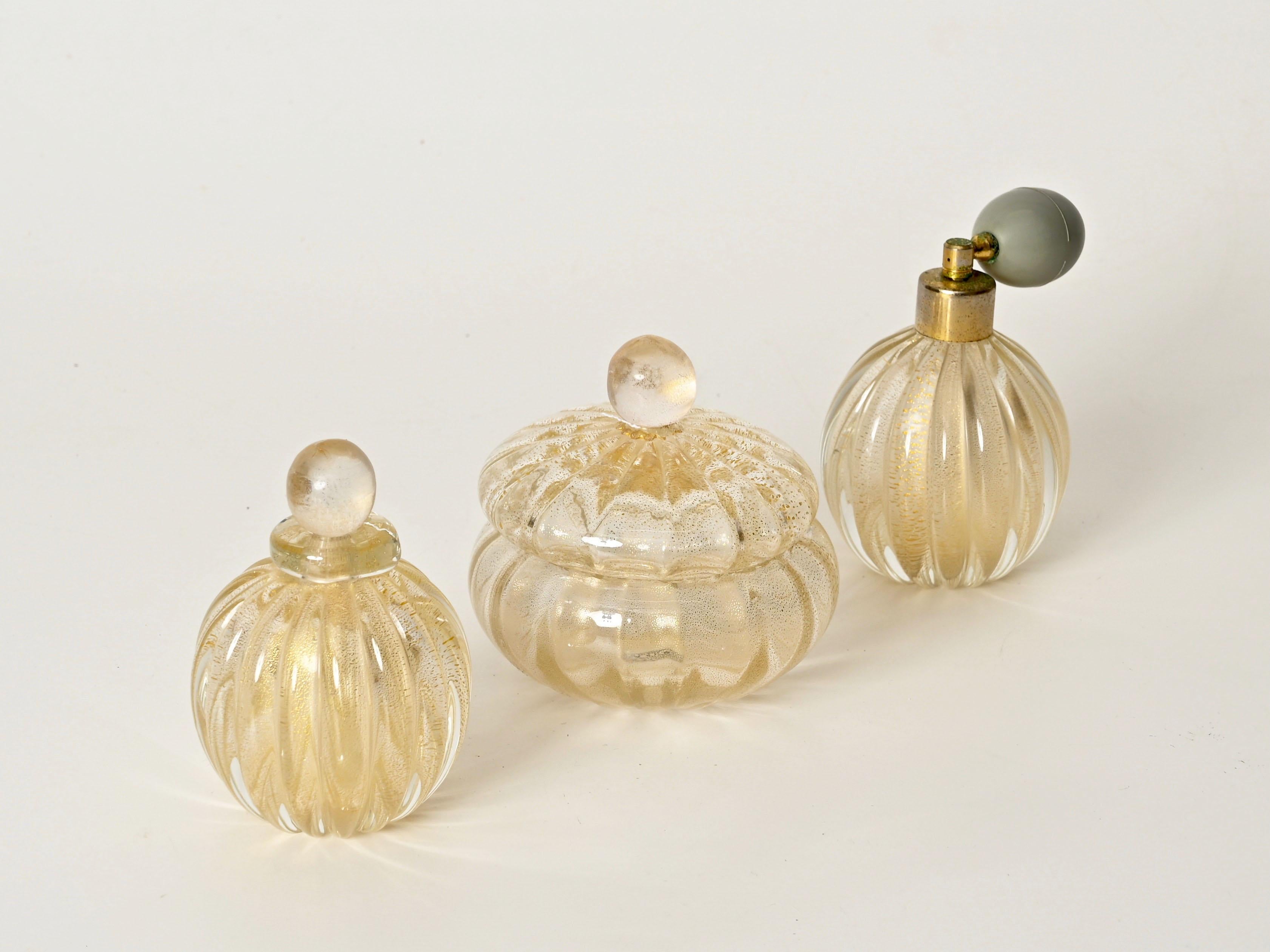 Stunning decorative vanity set of 3 Murano blown glass with 24k gold. This incredibly stylish and rare set was made by Barovier in Italy during the 1950s.

In fabulous conditions, with no chips or cracks.  This splendid Murano set is a true