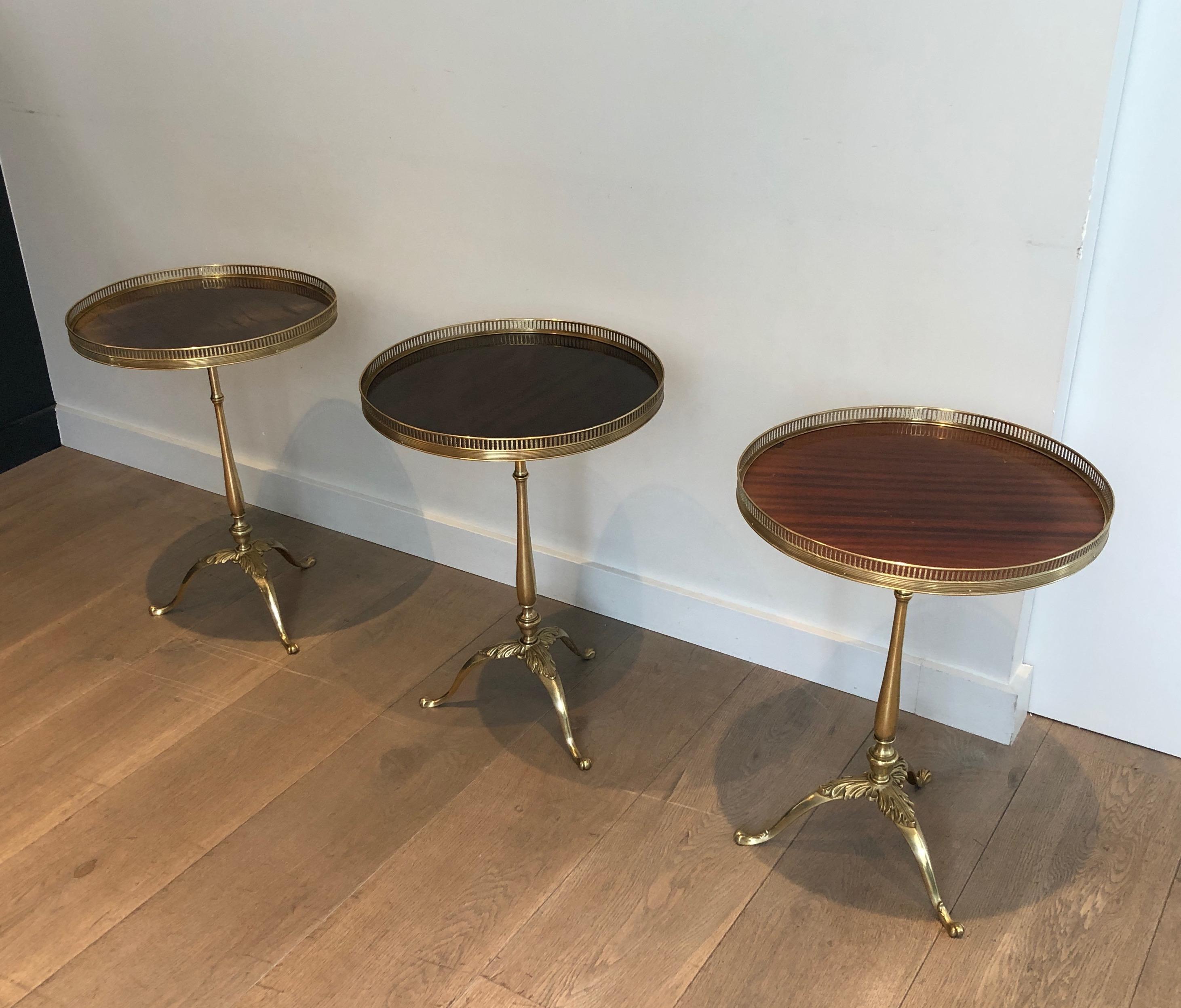 This set of 3 neoclassical style side table also called Martini tables are made of brass and mahogany. These end tables are attributed to famous French designer Maison Jansen, circa 1940
We have 3 of these tables.