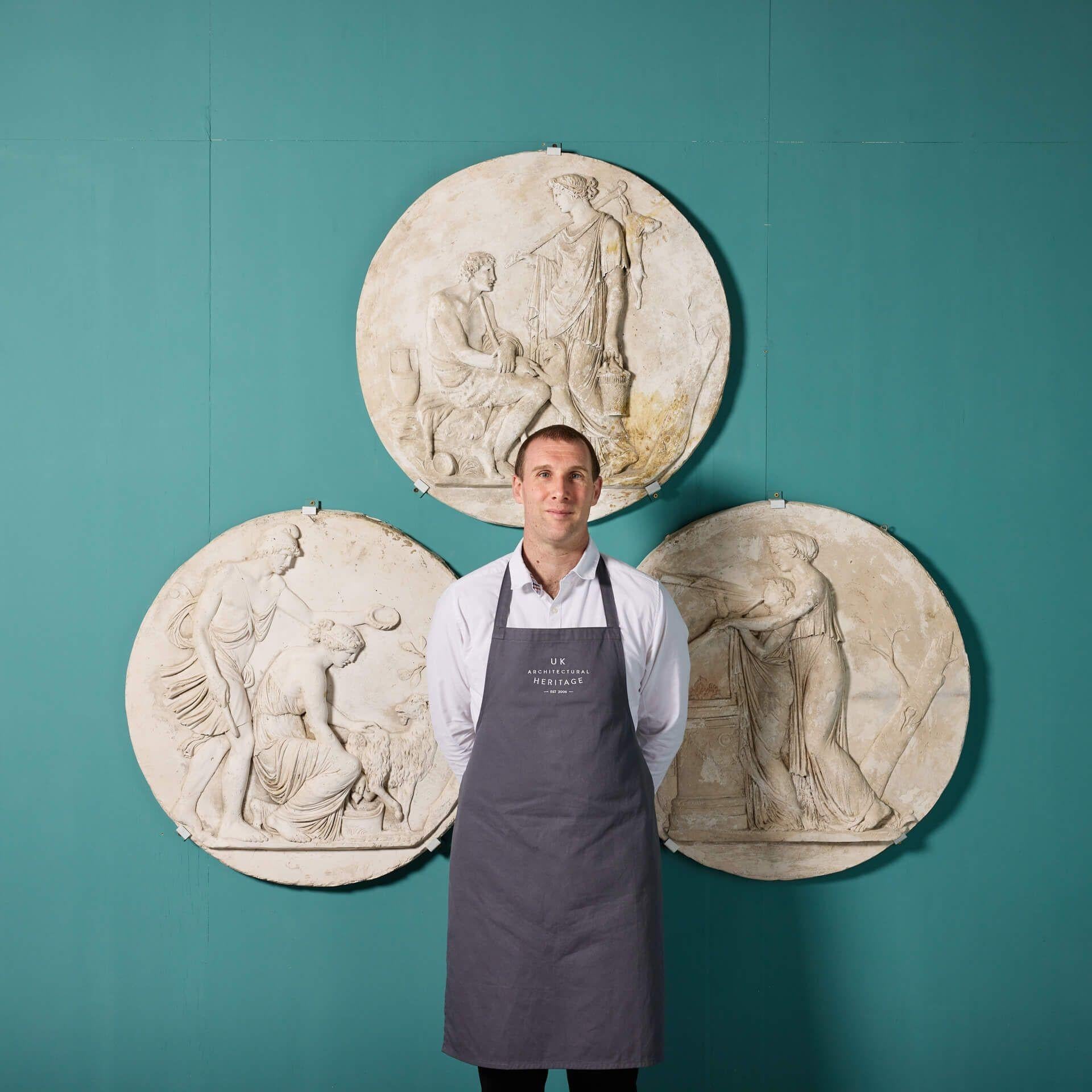 Three large neoclassical style plaster wall roundels after renowned Italian sculptor, Antonio Canova (1757 – 1822).

These impressive sculpted wall plaques depict classical, Greek style scenes in relief. These include (left to right): The Goat