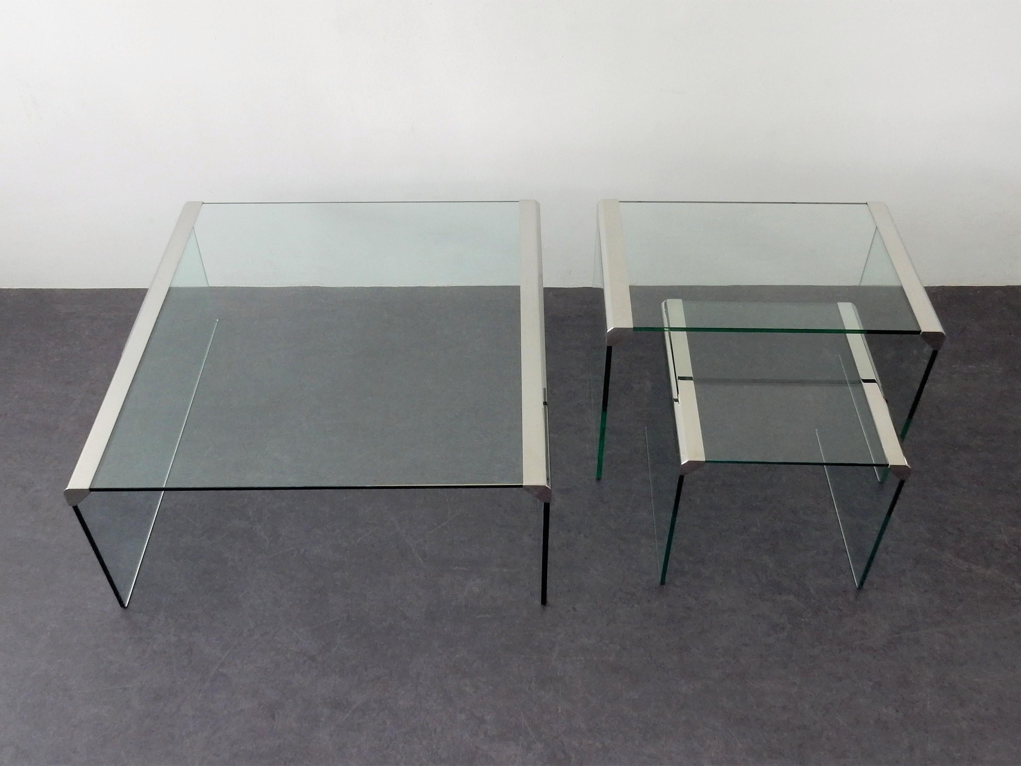 A very nice set of three different sized coffee tables designed by Pierangelo Gallotti for Gallotti & Radice. The tables are made of 8 mm tempered transparent glass with bright stainless steel metal parts. All three tables are in a very good