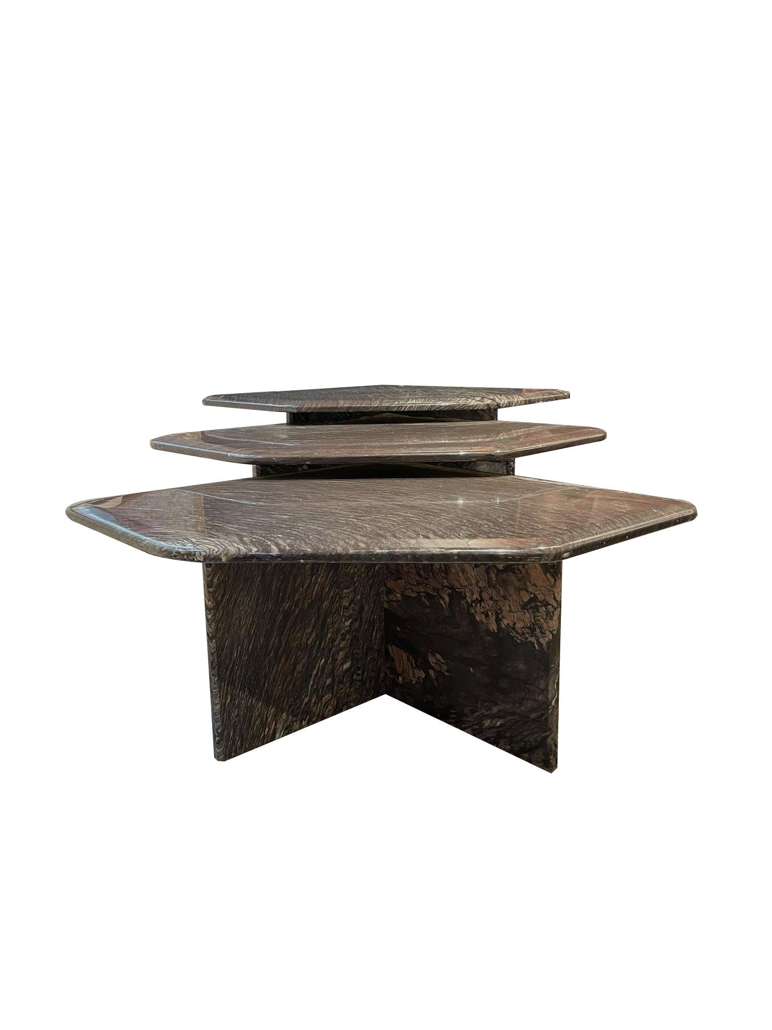 Graphic and Italian 1970's set of 3 nesting coffee tables in Cipolin marble with geometric top and cut angle with triangular pedestal bases. 
The 3 tables have tops of 74 x 58cm and have a height of: 32, 36 and 40 cm.