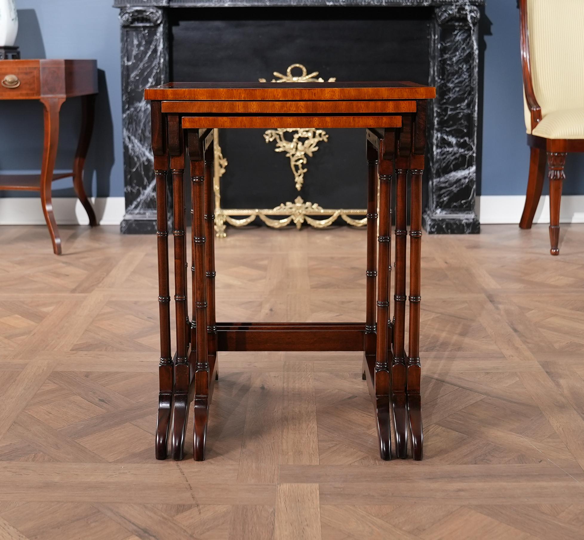 The Set of 3 Nesting Tables from Niagara Furniture features three tables, all with attractive inlaid mahogany tops. Supported on hand carved, solid mahogany legs which are turned to resemble bamboo the tables even have an apron on the sides for