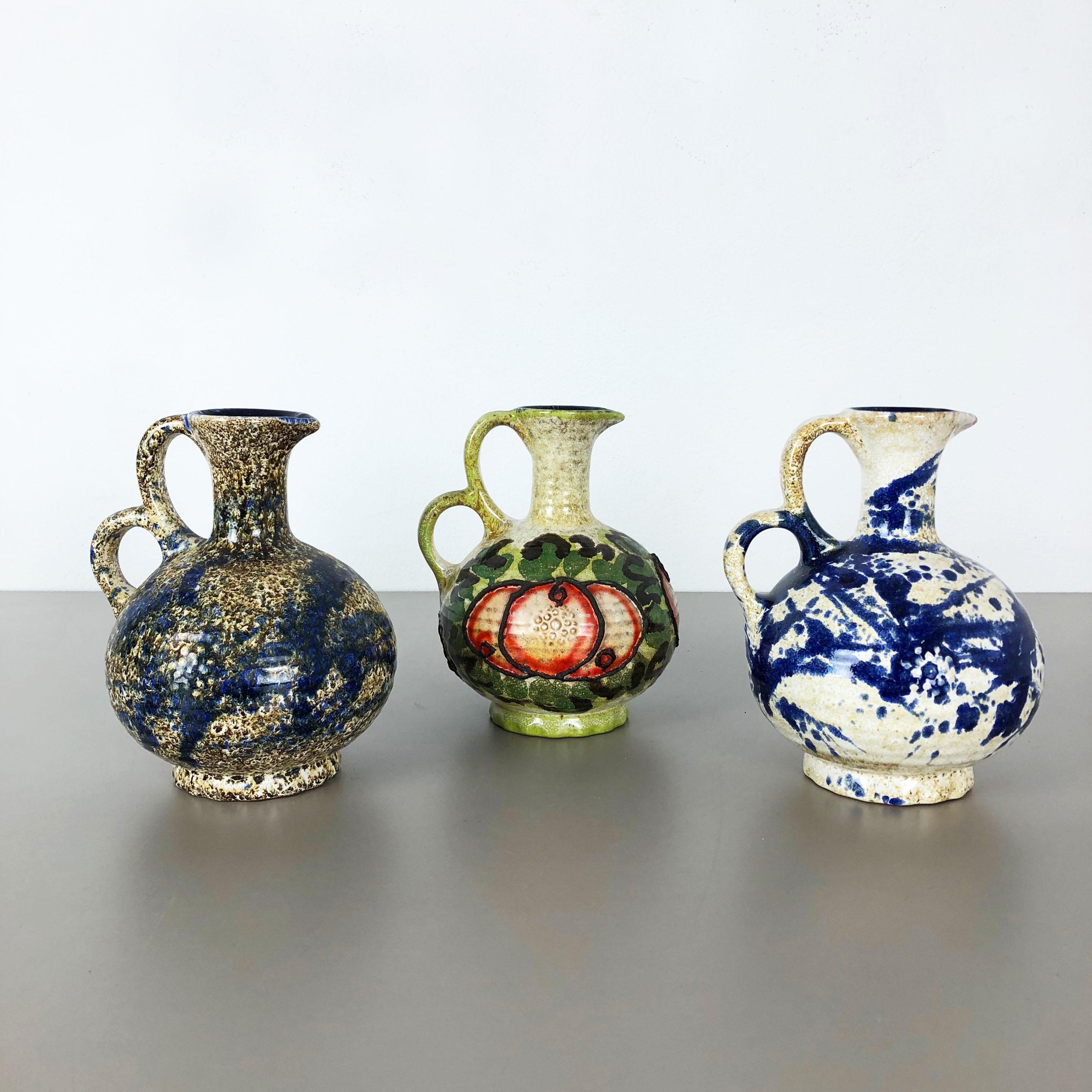 Article:

Ceramic fat lava vases set of 3


Producer:

Marei Ceramics, Germany


Decade:

1970s



Description:

Set of 3 original vintage Studio Pottery vases was produced in the 1970s by Marei Ceramics, Germany. Rare set of 3