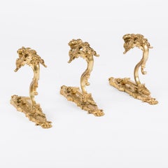 Set of 3 ornate gilt bronze curtain hooks in the Louis XV style
