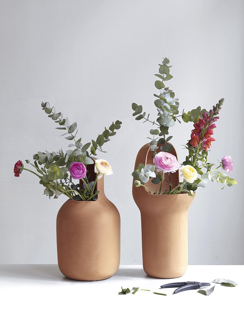Jaime Hayon designed the Gardenia Vases in terracotta as a complement to his outdoor furniture collection. 

The three vases are unique in form, illustrating Hyaon's unmistakable hallmark design. Handcrafted in treated terracotta to withstand all