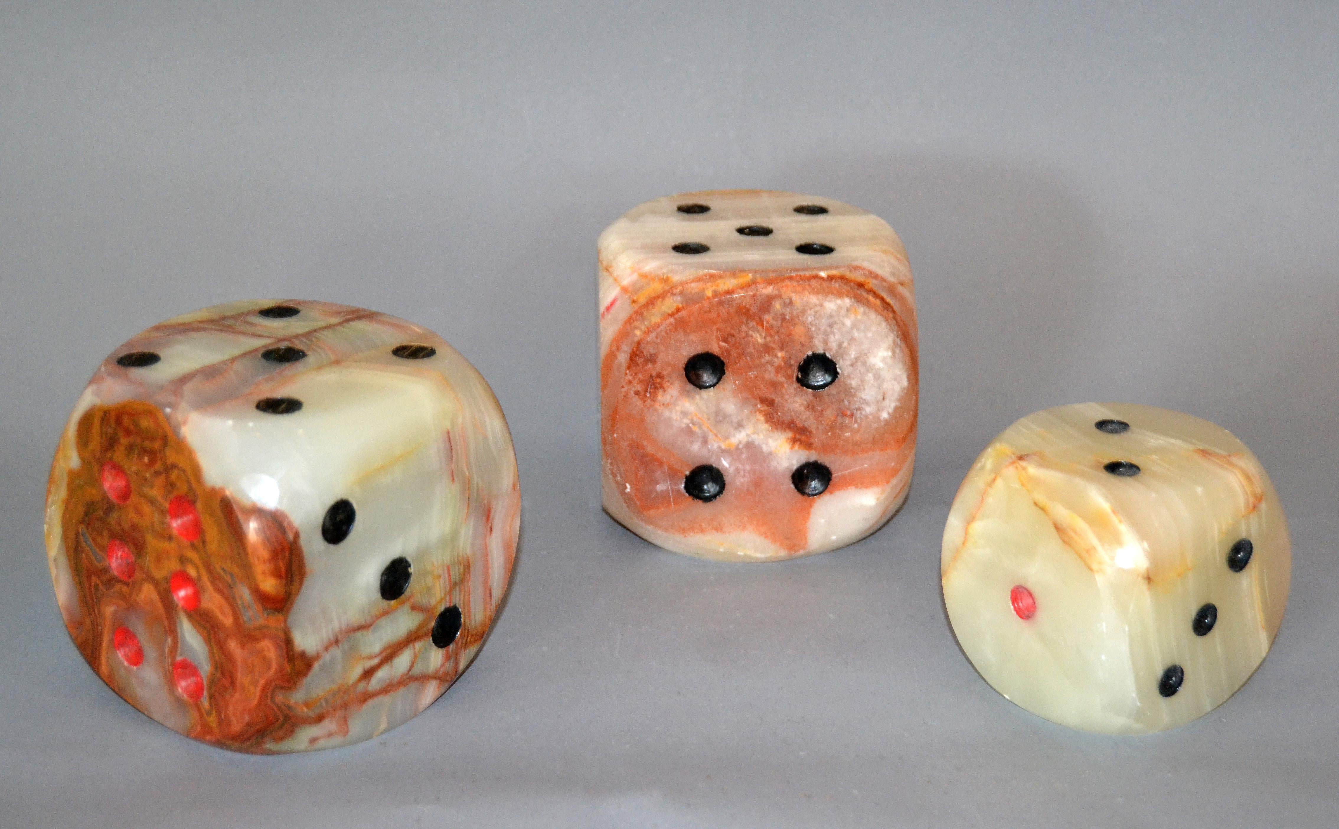 Set of 3 oversized Mid-Century Modern handcrafted marble and onyx dice table sculptures.
Two have the same size, one is smaller.
Stunning grain pattern. The set works very well as bookends too.
Dimension smaller dice:
3.13 x 3.13 x 3.13 inches.