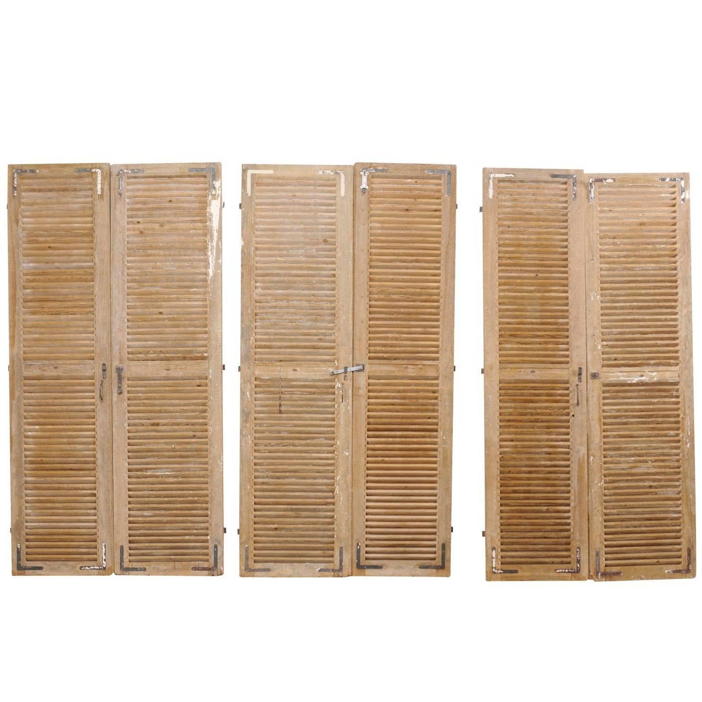 Set of Three Pairs of French 19th Century Natural Wood Shuttered Doors