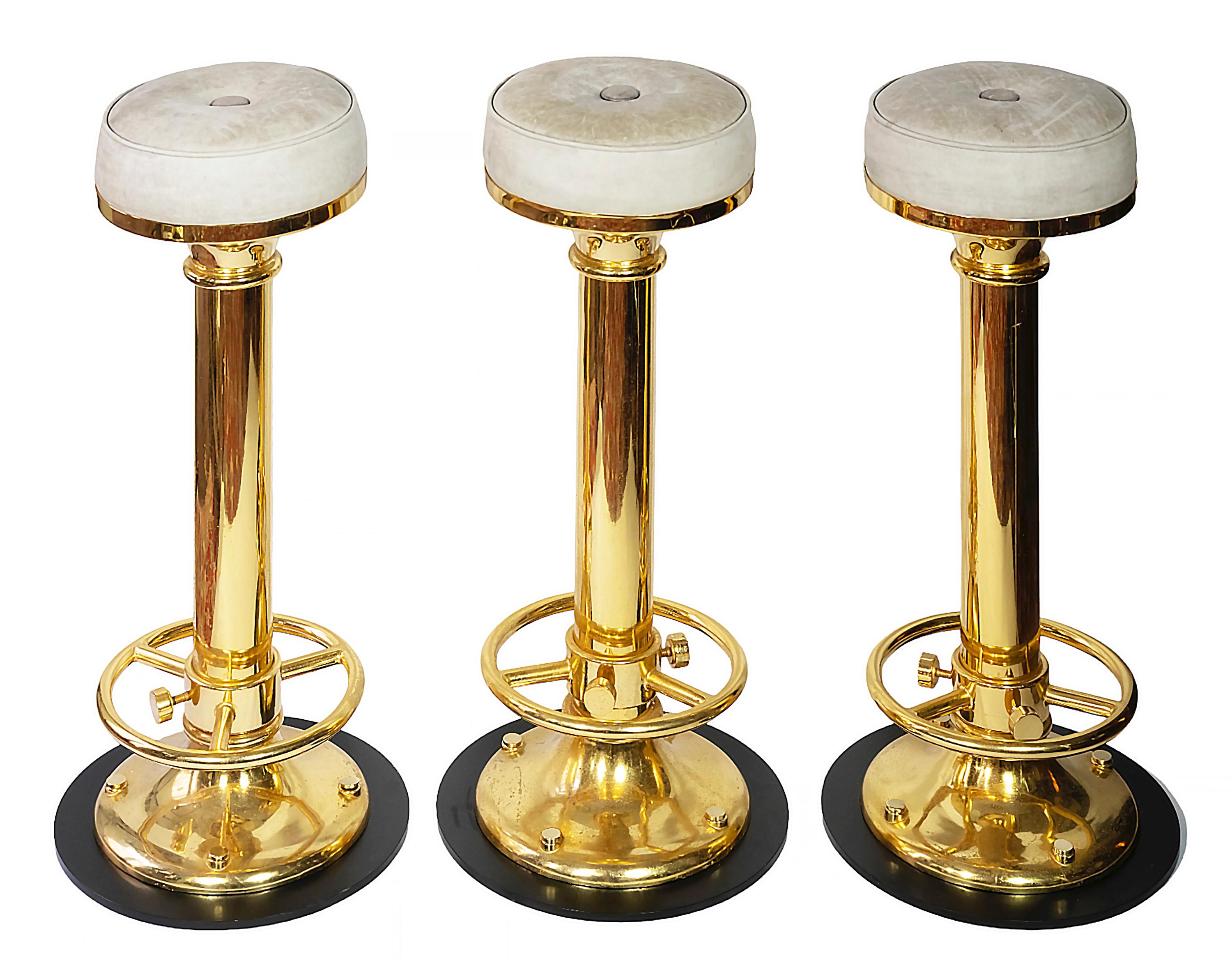 The set of 3 pcs. Italian jacht bar stools.
The base is made of gilt metal and black steel with light grey natural leather upholstery.
Each stool weights 23,3 kg.
Very good vintage condition.
 