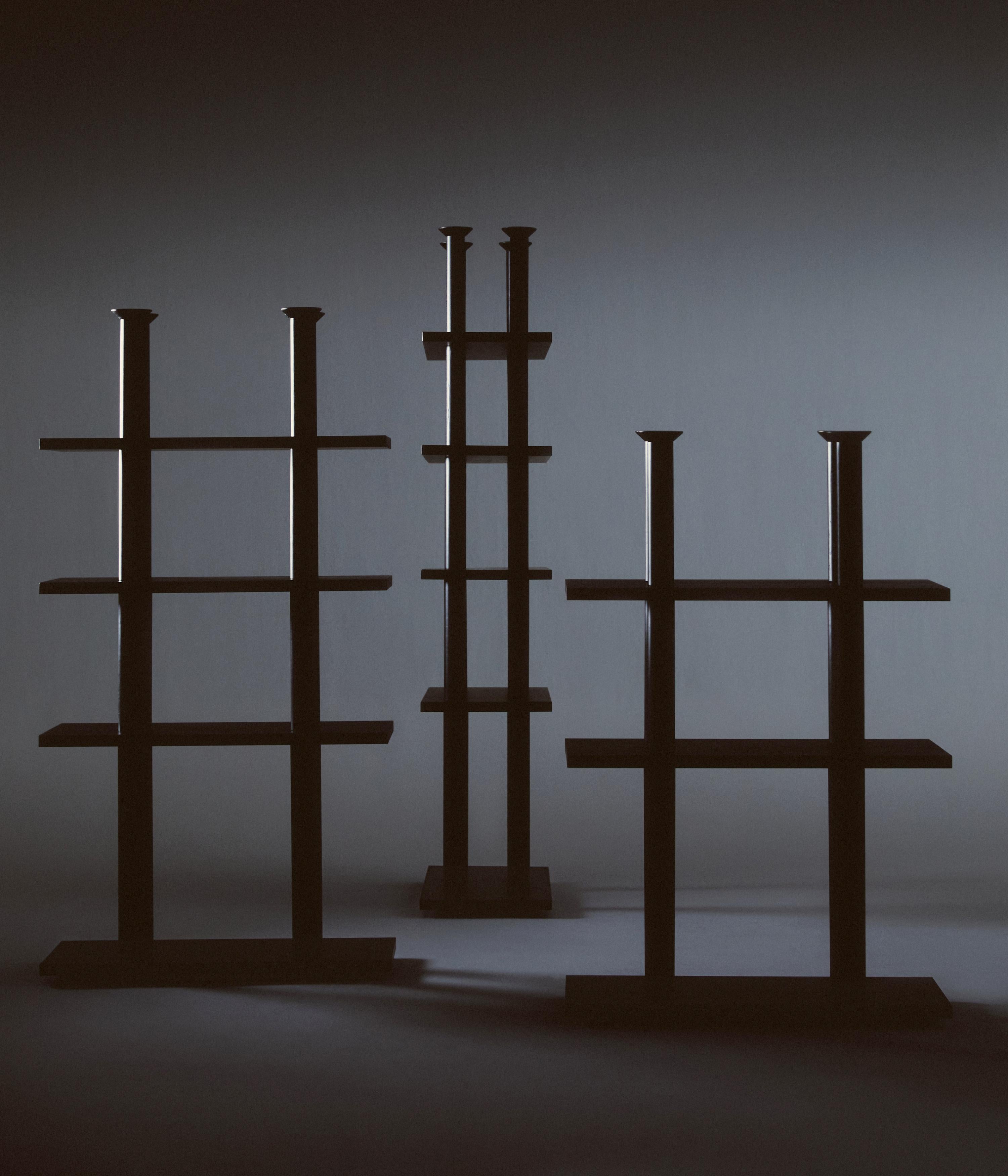 Set of 3 Peristylo Shelves by Oscar Tusquets
Dimensions: 4 Shelves: D 40 x W 92 x H 211 cm.
3 Shelves: D 40 x W 92 x H 176 cm.
2 Shelves: D 40 x W 92 x H 141 cm.
Materials: Solid ash wood and stained black wood.

Shelving and base in solid ash