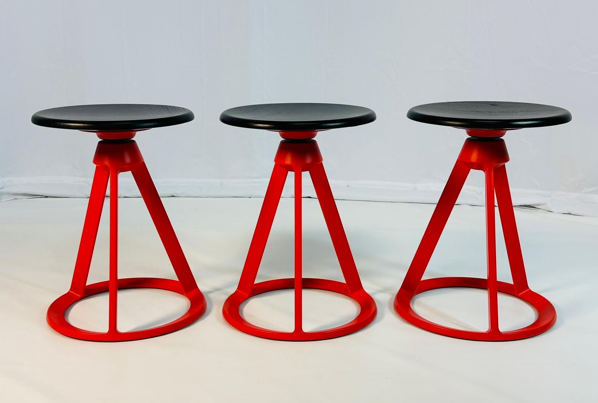 Set of three Piton stools designed by Edward Barber and Osgerby in 2013 and manufactured by Knoll. 
 
The stools are made in die cast steel with a wooden swivel seat. 
 
All of the three pieces are signed. 
 
Measurements: 
 18 inches high x 13