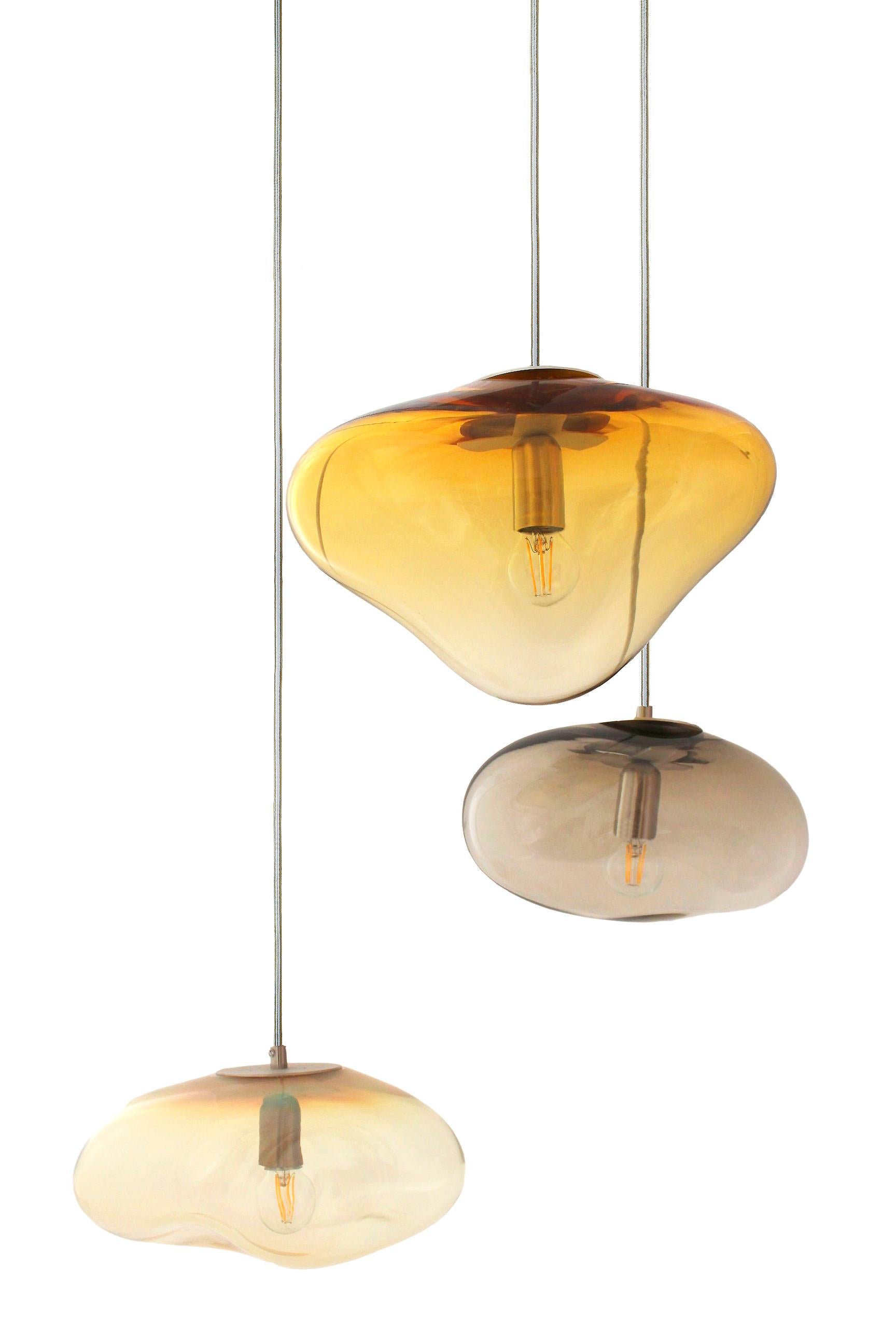 Set of 3 planetoide seresi gold pendants by Eloa.
No UL listed 
Material: glass, steel, silver, LED bulb
Dimensions: D30 x W30 x H250 cm
Also available in different colours and dimensions.

All our lamps can be wired according to each country. If
