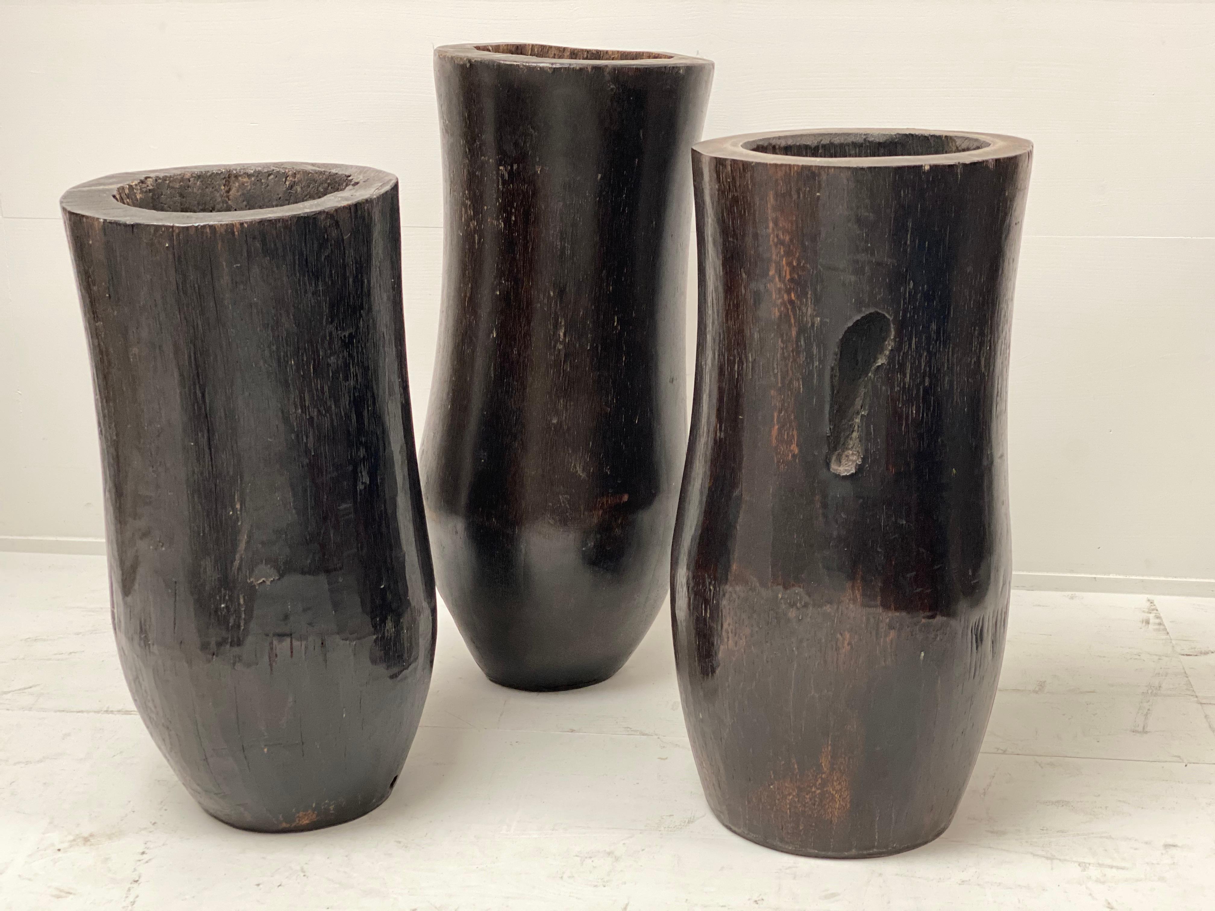 Very decorative Vintage set of 3 wooden planters in Palmtreewood,
beautiful dark tinted brown color, great shine and patina of the wood,
Asia, Indonesia,1960

different sizes,
59 cm high/54 cm high/ 50 cm high
diameter 25 cm.