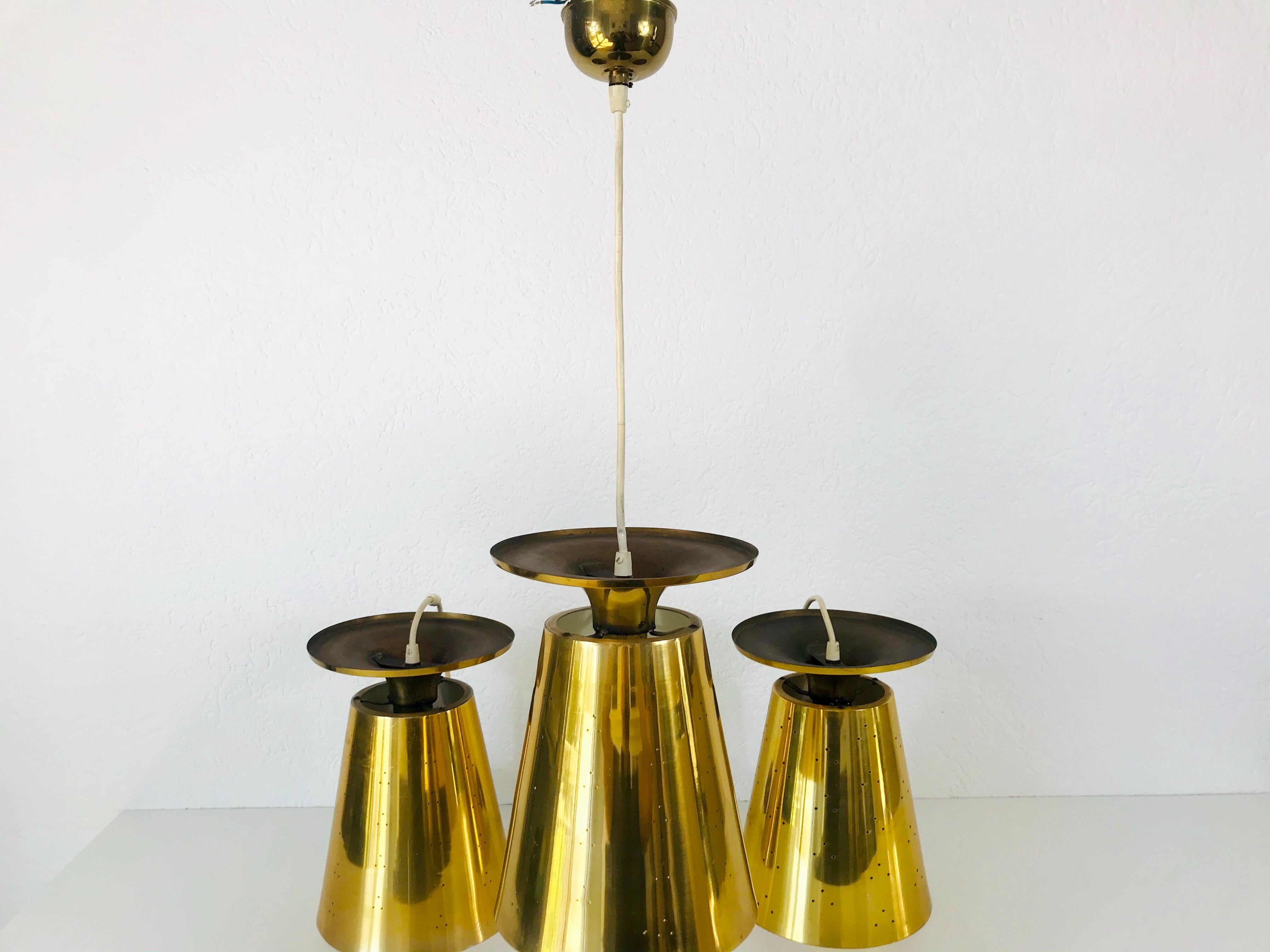 Set of 3 Polished Brass Pendant Lamps Attributed to Paavo Tynell, 1950s For Sale 5