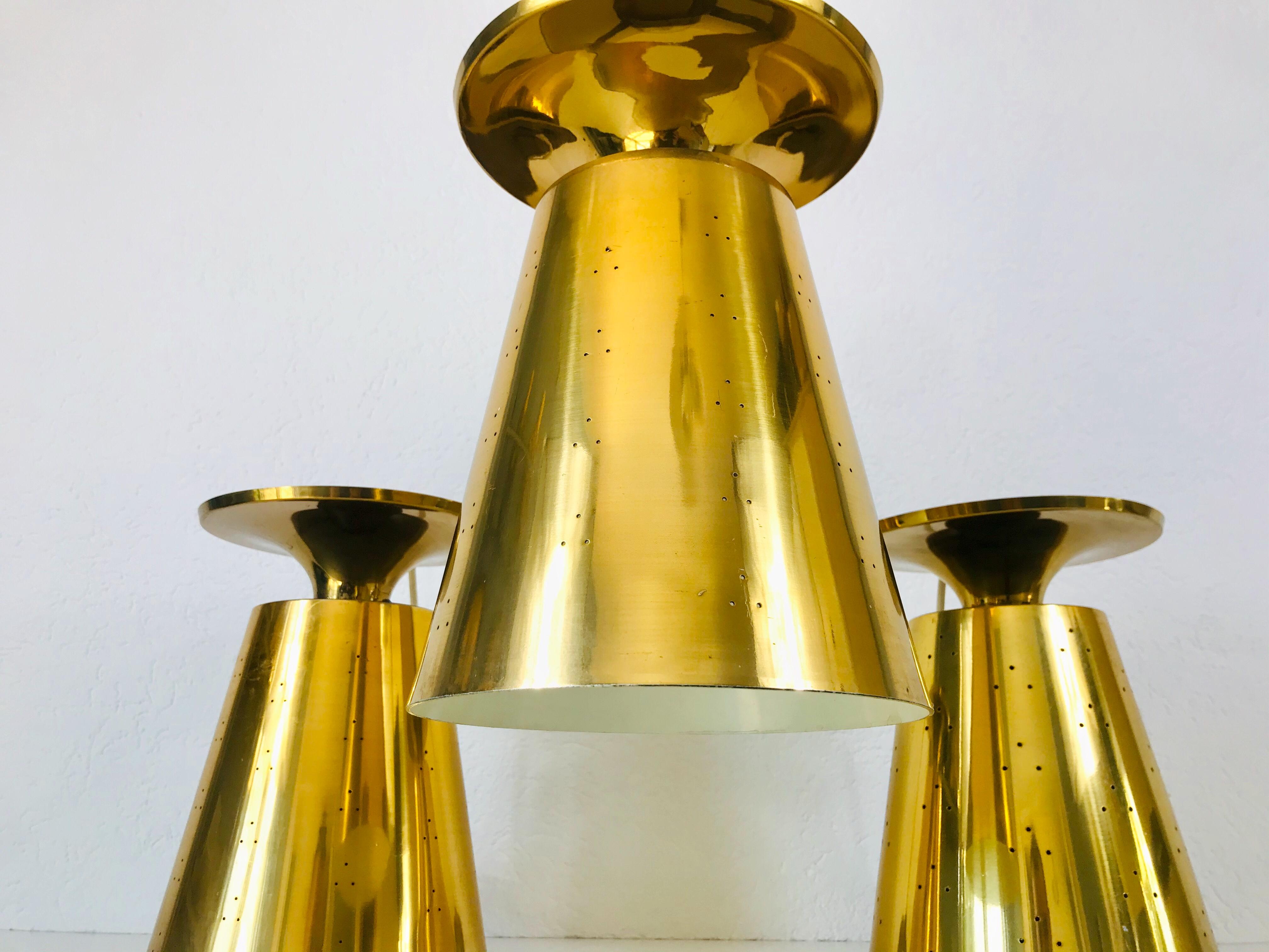 Mid-Century Modern Set of 3 Polished Brass Pendant Lamps Attributed to Paavo Tynell, 1950s For Sale