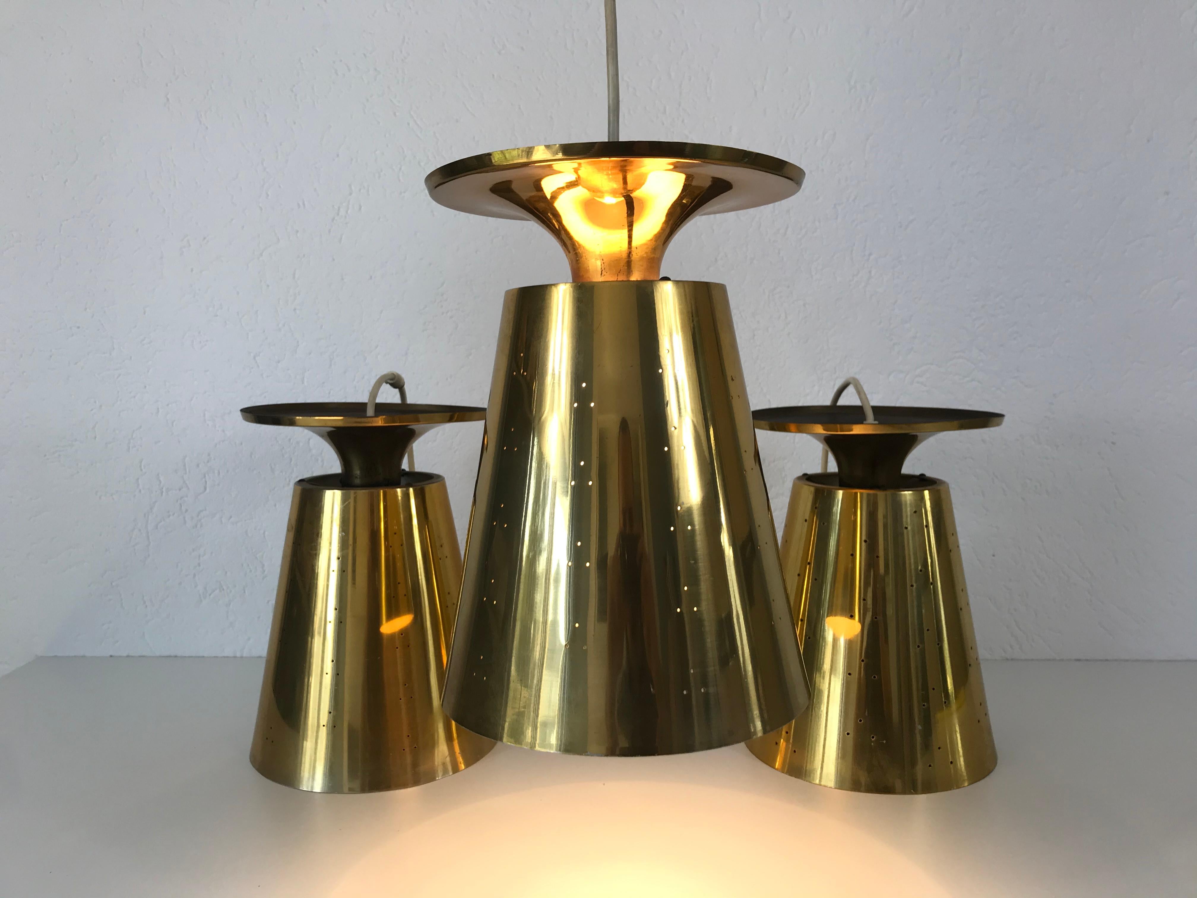 Mid-20th Century Set of 3 Polished Brass Pendant Lamps Attributed to Paavo Tynell, 1950s For Sale