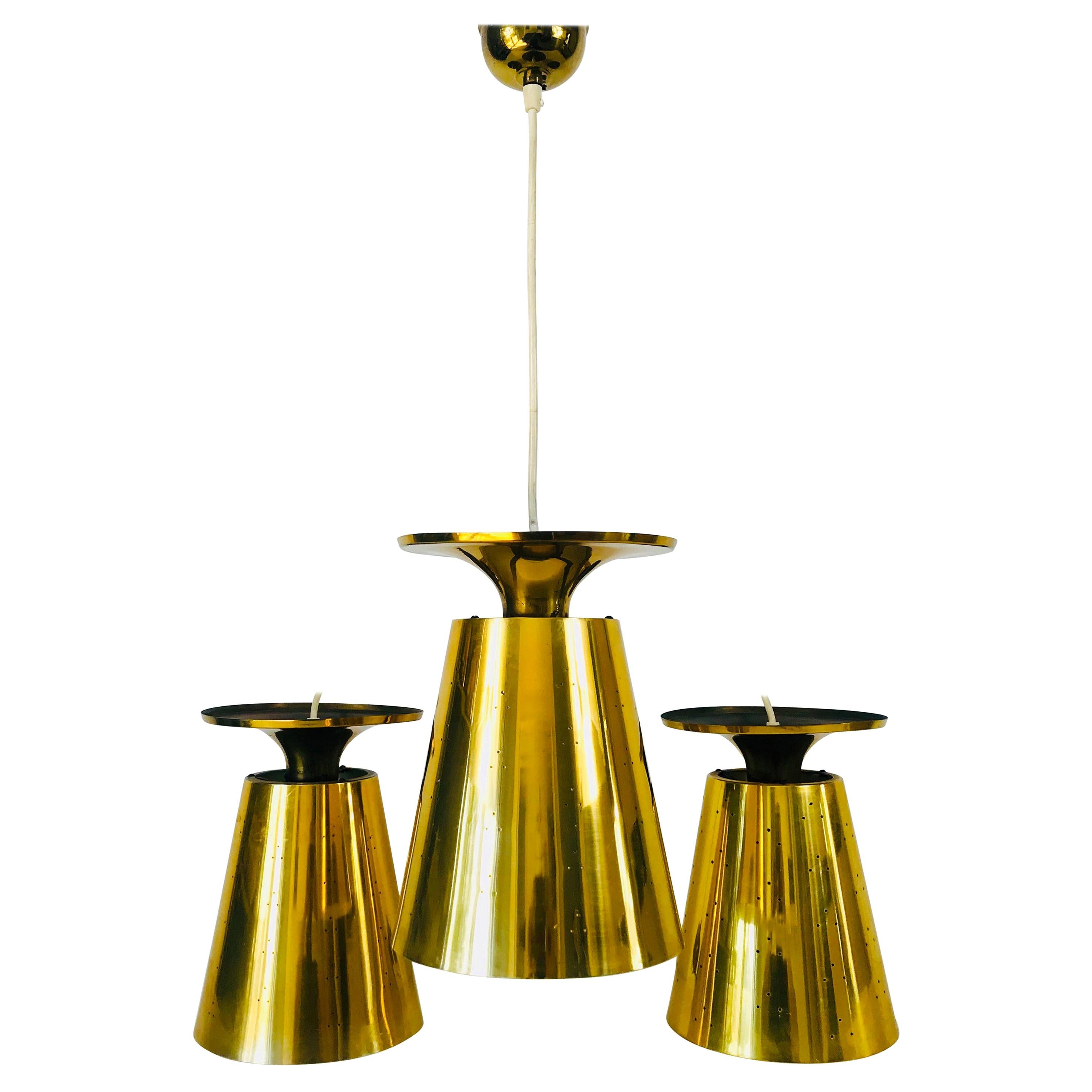 Set of 3 Polished Brass Pendant Lamps Attributed to Paavo Tynell, 1950s