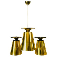 Set of 3 Polished Brass Pendant Lamps Attributed to Paavo Tynell, 1950s