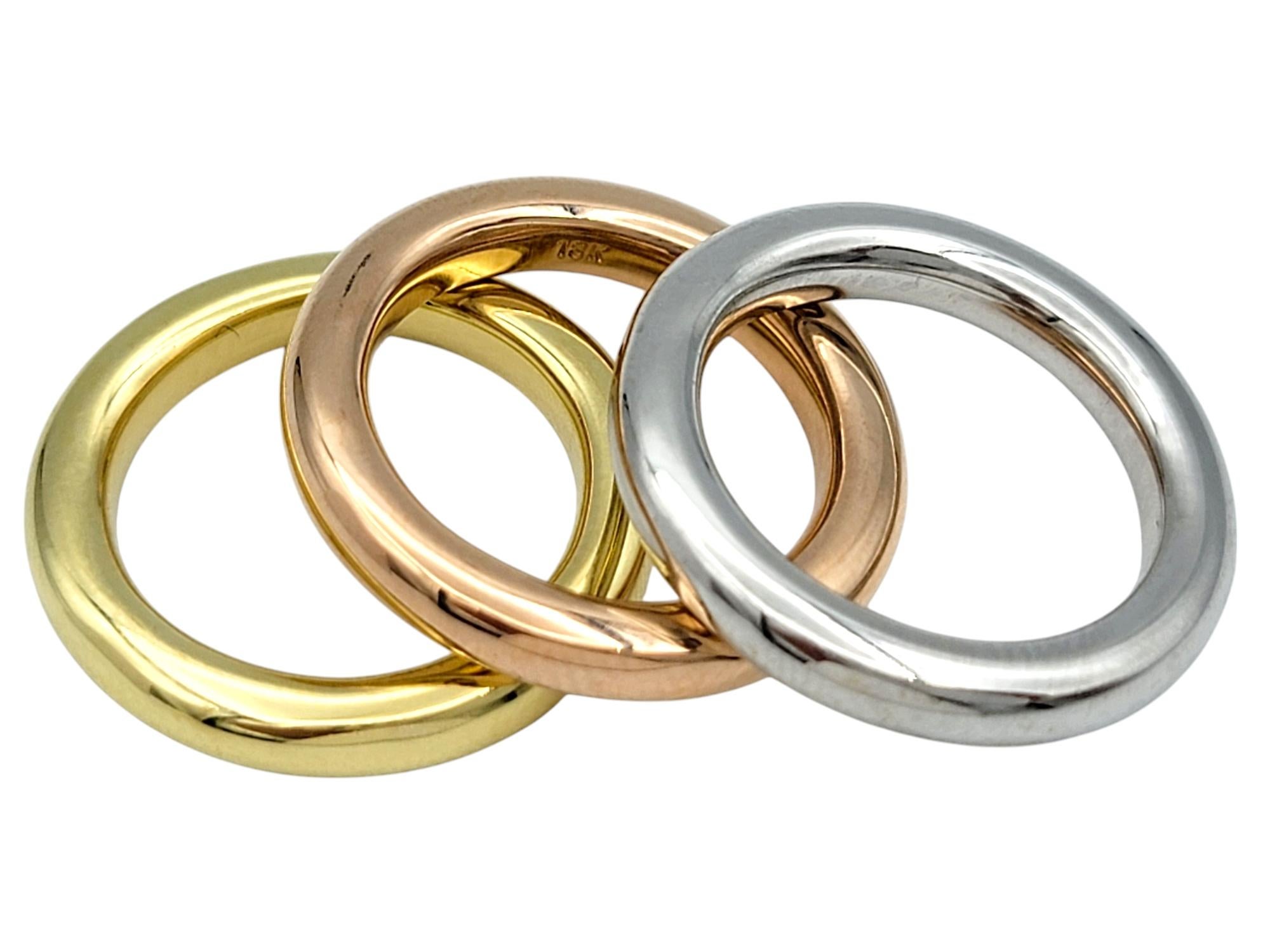 Ring Size: 5.75

Discover the beauty of simplicity with this stunning trio of sleek band rings, each a timeless testament to understated elegance. Crafted in 18 karat yellow gold, white gold, and rose gold, these rings exude a refined sophistication