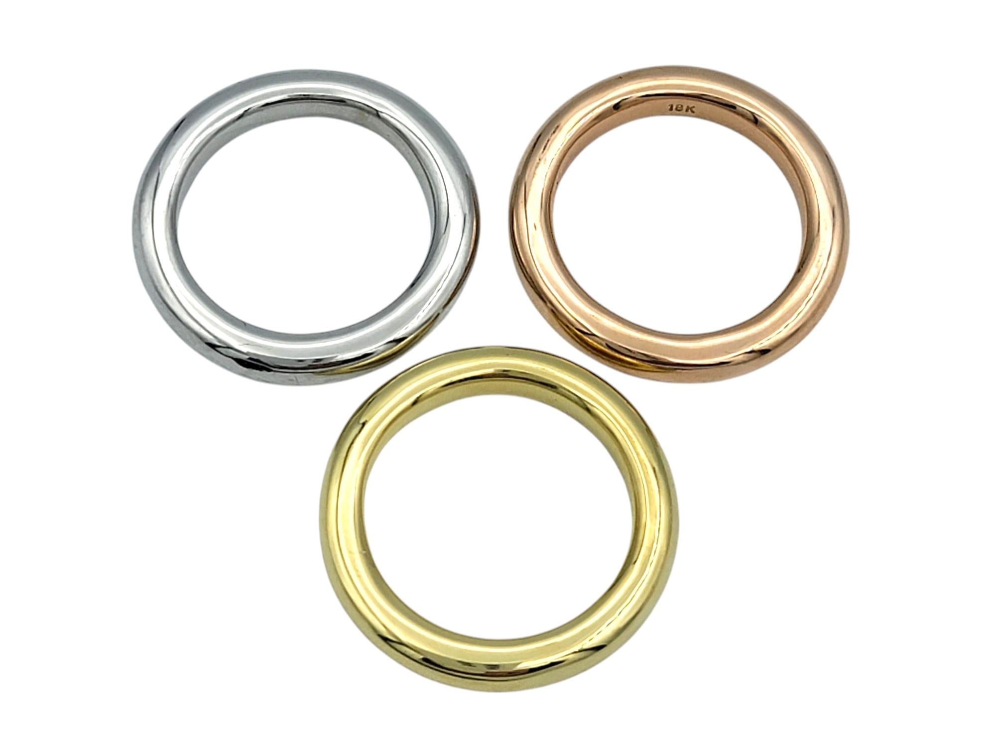 Contemporary Set of 3 Polished Stacking Band Rings in 18 Karat White, Rose and Yellow Gold For Sale