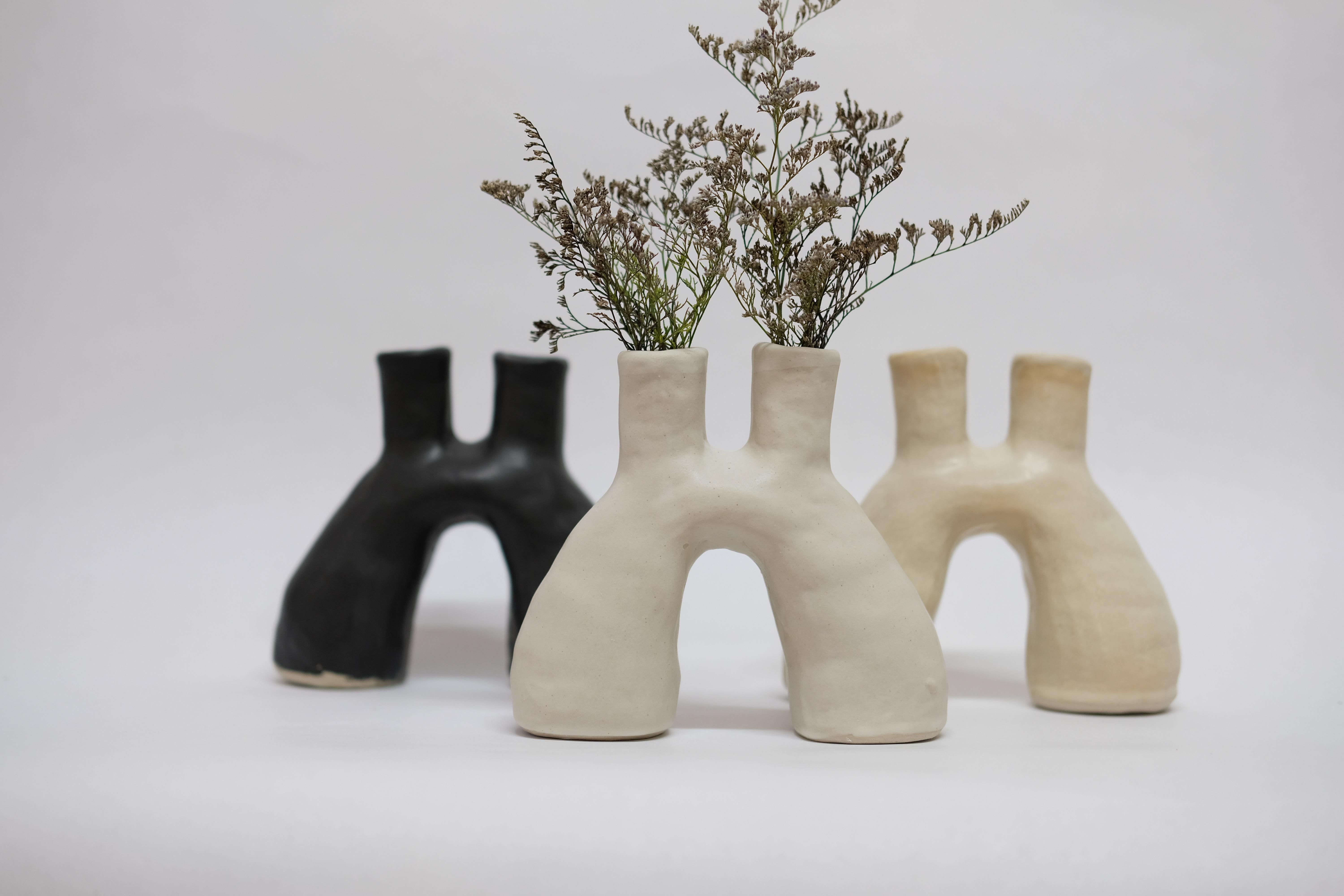 Set of 3 portal stoneware vases by Camila Apaez
One of a kind
Materials: Stoneware
Dimensions: 7 x 17 x 14 cm
Options: White bone, butter milk, stone sage.

This year has been shaped by the topographies of our homes and the uncertainty of our