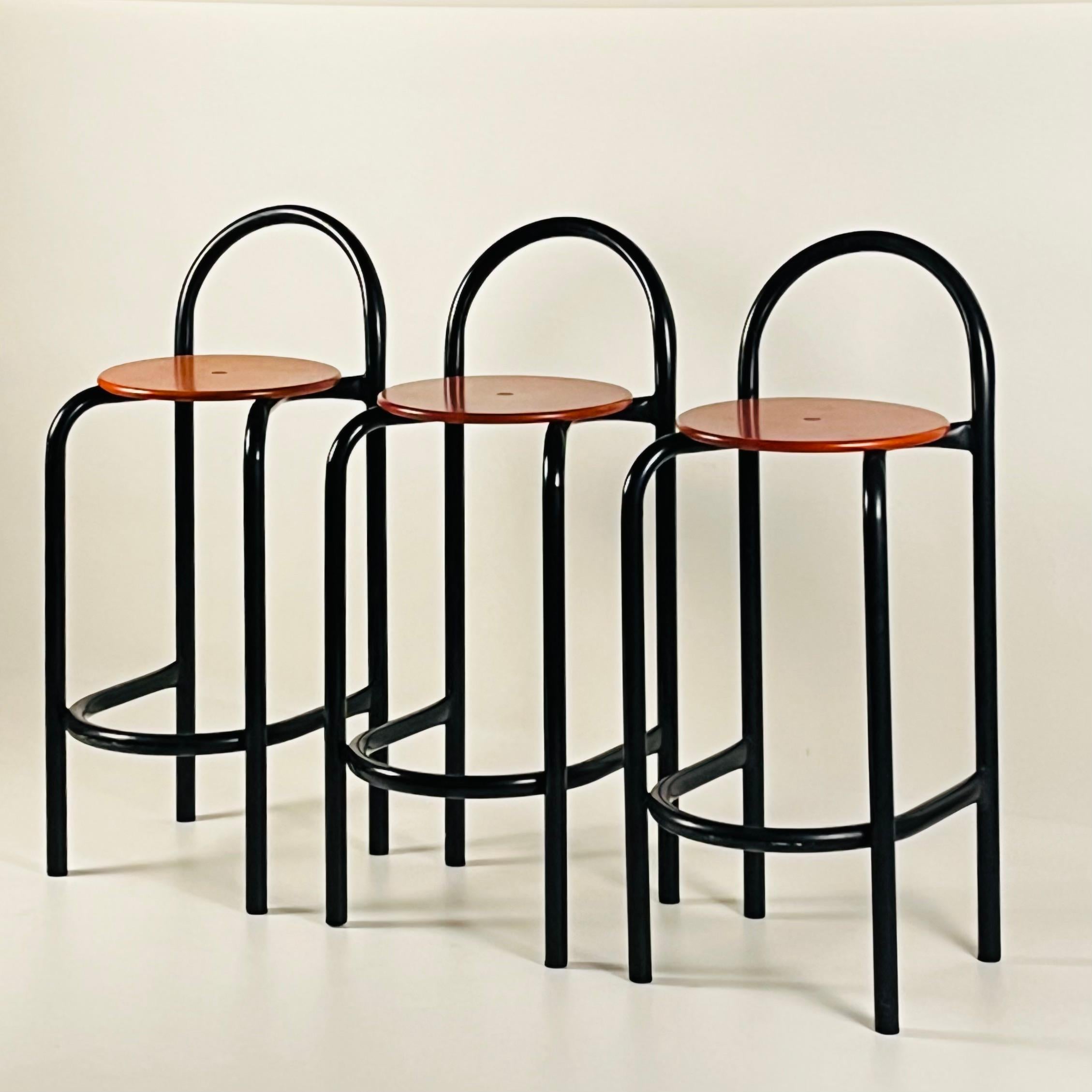 These sturdy stools feature powder-coated steel frames for durability and composite wood seats for comfort. Their cool minimalist design makes these stools a stylish choice for any modern bar area or kitchen counter. 