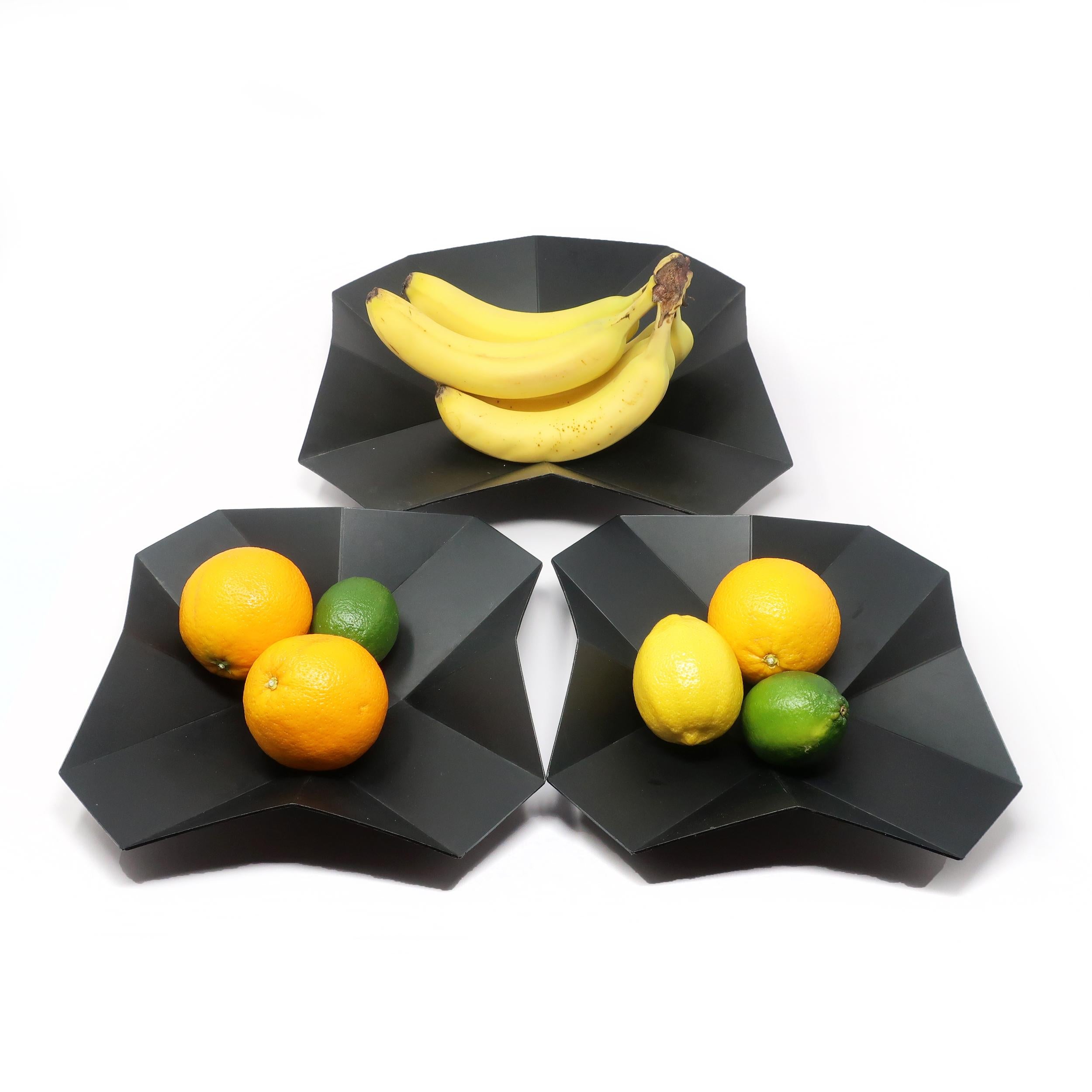 The French duo of Judith Tair, a fashion designer, and Philippe Mercier, an art director, are the creators behind a line of whimsical placemats and plates that were wildly successful in the 1980s. This set of 3 Origami plates are dated 1987 and
