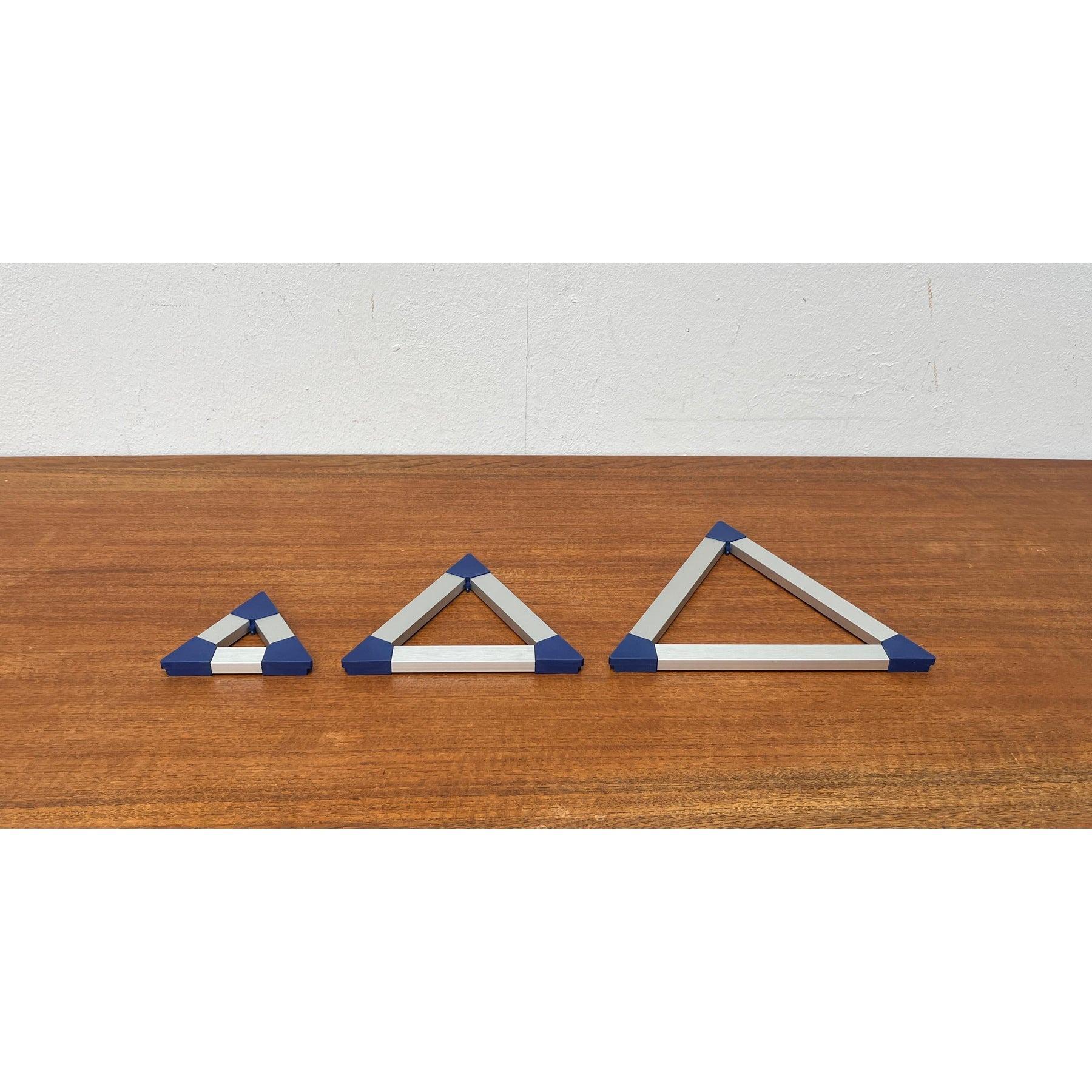 Danish Postmodern Triangular Trivet Coasters by Jorgen Meldgaard for Menu, 1980s, 1980s, Set of 3, in Very Good conditions. Designed 1980 to 1989 This piece has an attribution mark.

Additional information:
Materials: Metal, Plastic
Color: