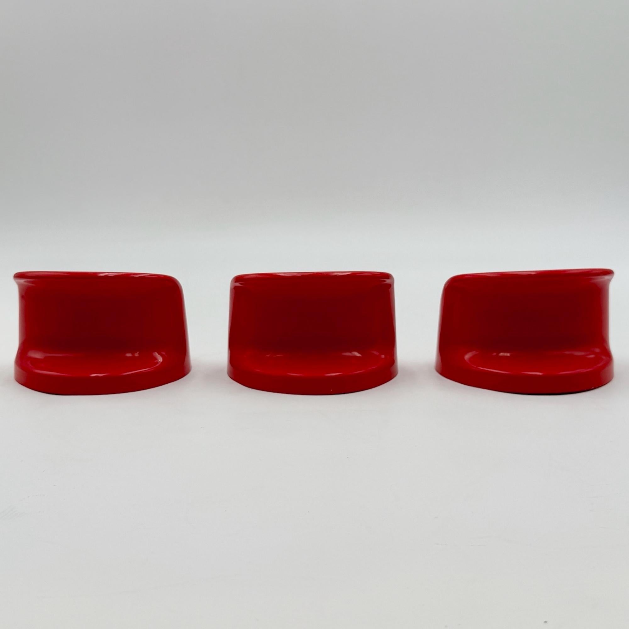 This rare set of 3 wall hooks was designed in 1972 by Austrian designer Olaf von Bohr for Kartell, Italy. Known as Model 4702, the hooks are celebrated for their sculptural silhouette and bold use of color. They received an honorable mention at the