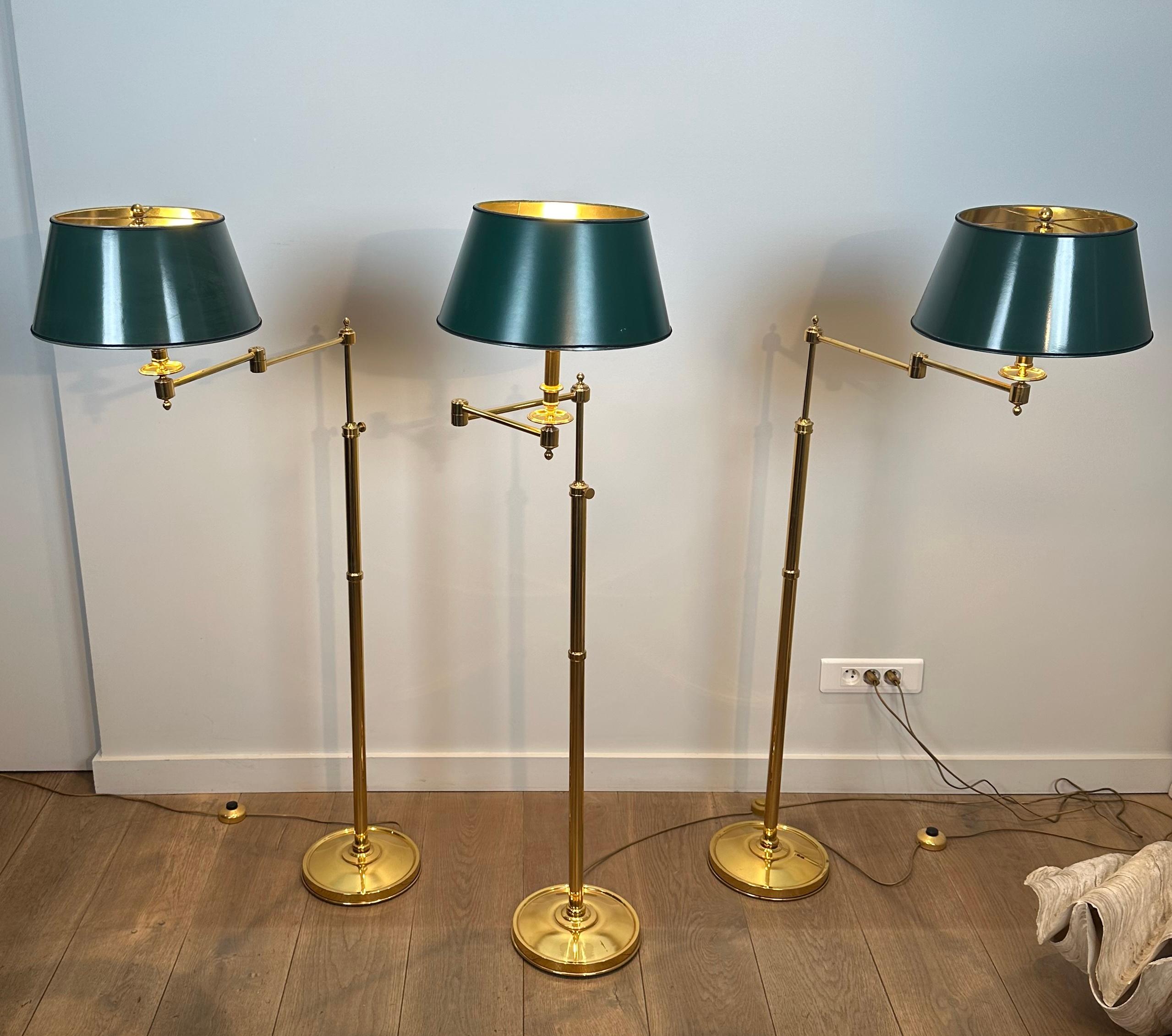 Set of 3 Reading lamps with removable brass arms and synthetic green shade in painted sheet metal style. French work in the style of Maison Jansen. Circa 1970