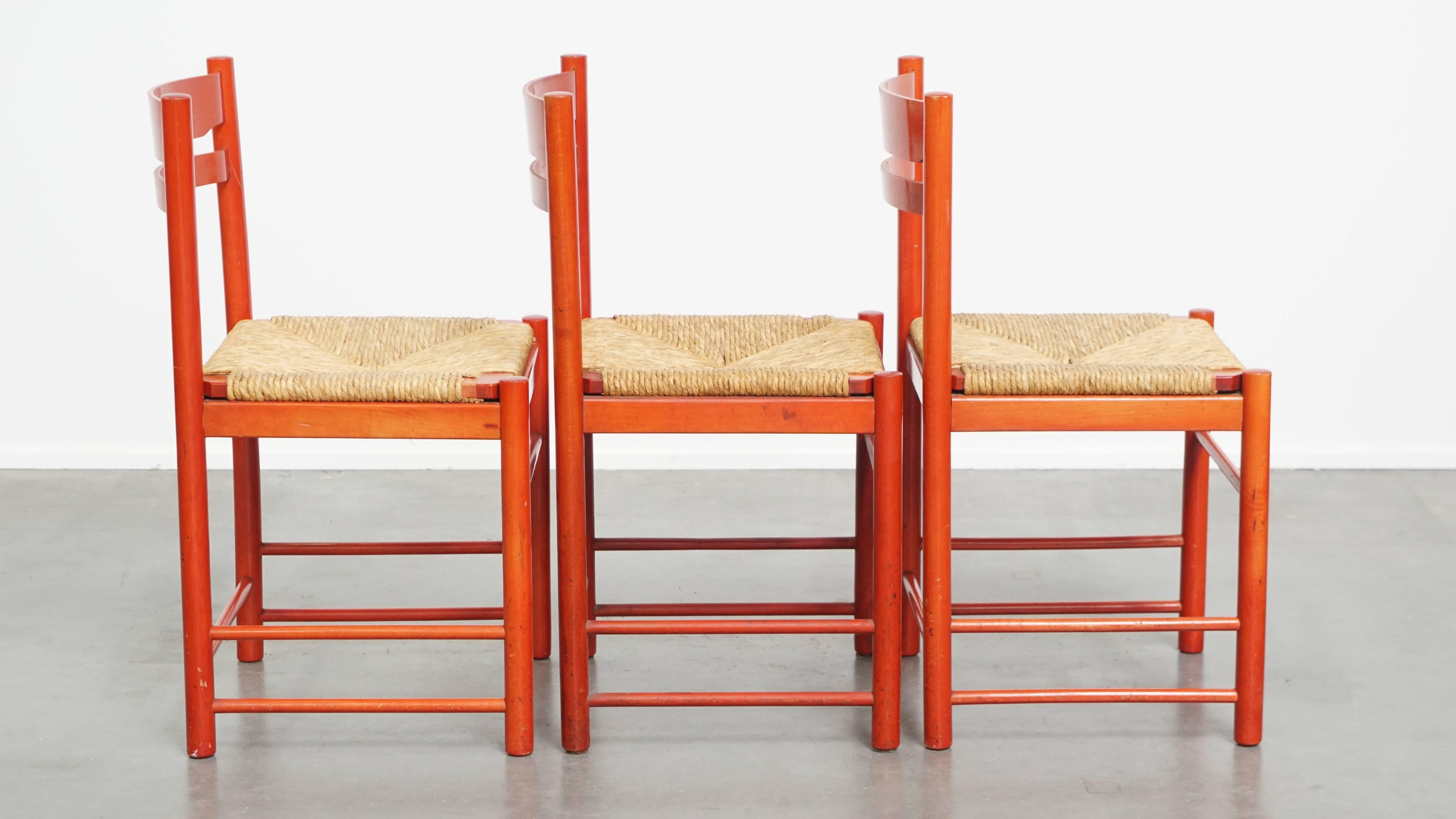 Hand-Crafted Set of 3 red vintage wooden chairs from the 1970s with a woven wicker seat For Sale